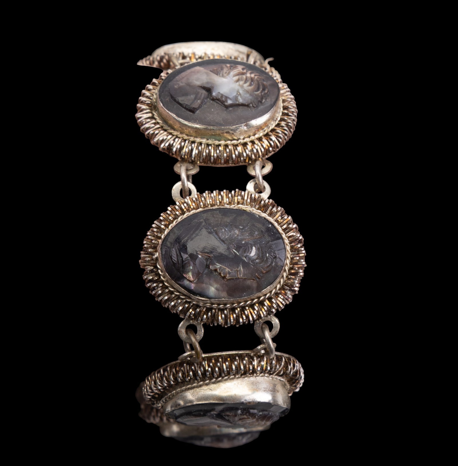 800 Silver Antique Cameo Jewelry: A collection of antique 800 purity silver cameo jewelry featuring a ring, size 7.5, a pair of clip on earrings, and matching necklace on a scroll link chain, and an abalone carved cameo bracelet. Tota