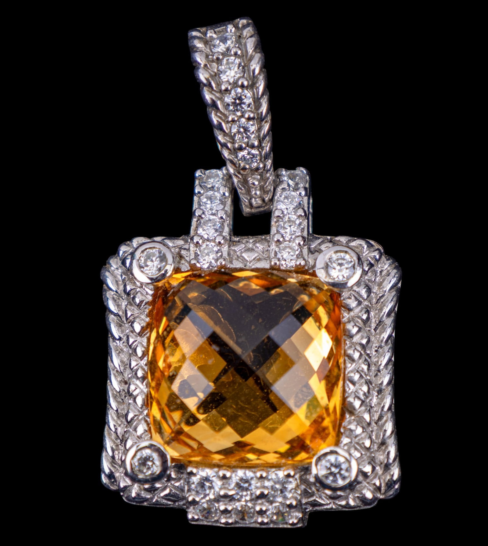 Judith Ripka Sterling Silver and Topaz Pendant: A Judith Ripka sterling silver pendant with large cushion square cut yellow topaz, approx. 8x8mm, and cubic zirconia accents, weighs approx. 18g total.