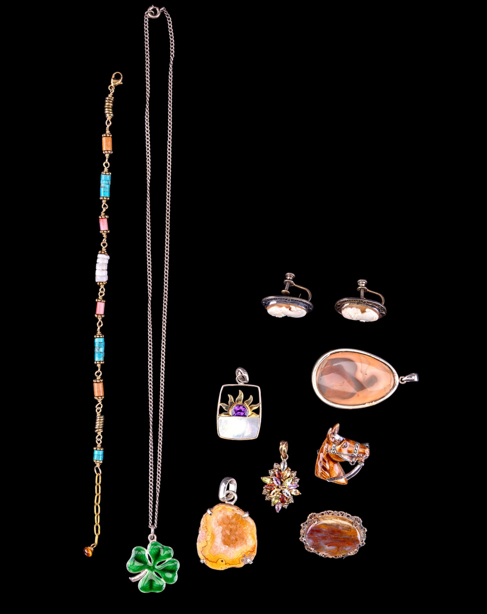Sterling Silver, Stone, and Other Jewelry: A collection of sterling silver jewelry including an enamel horsehead brooch, a banded agate filigree brooch, an enamel shamrock pendant on a 9" sterling chain, filigree cameo screwback earrings, drus
