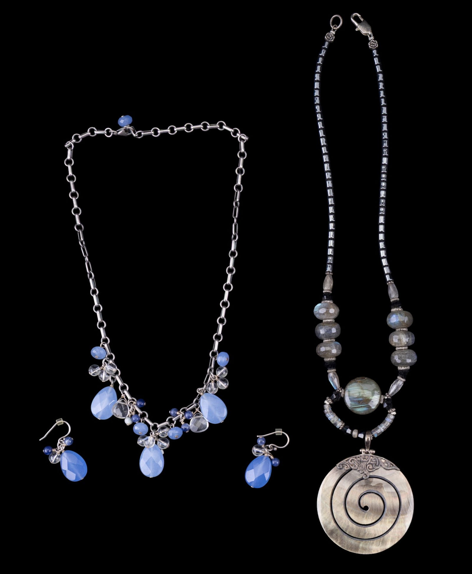 Sterling Silver and Stone Jewelry: A hematite, labradorite, and mother of pearl necklace with sterling silver bail, beads, and clasp, and a sterling silver collar necklace featuring chalcedony and sodalite, with matching French hook ea