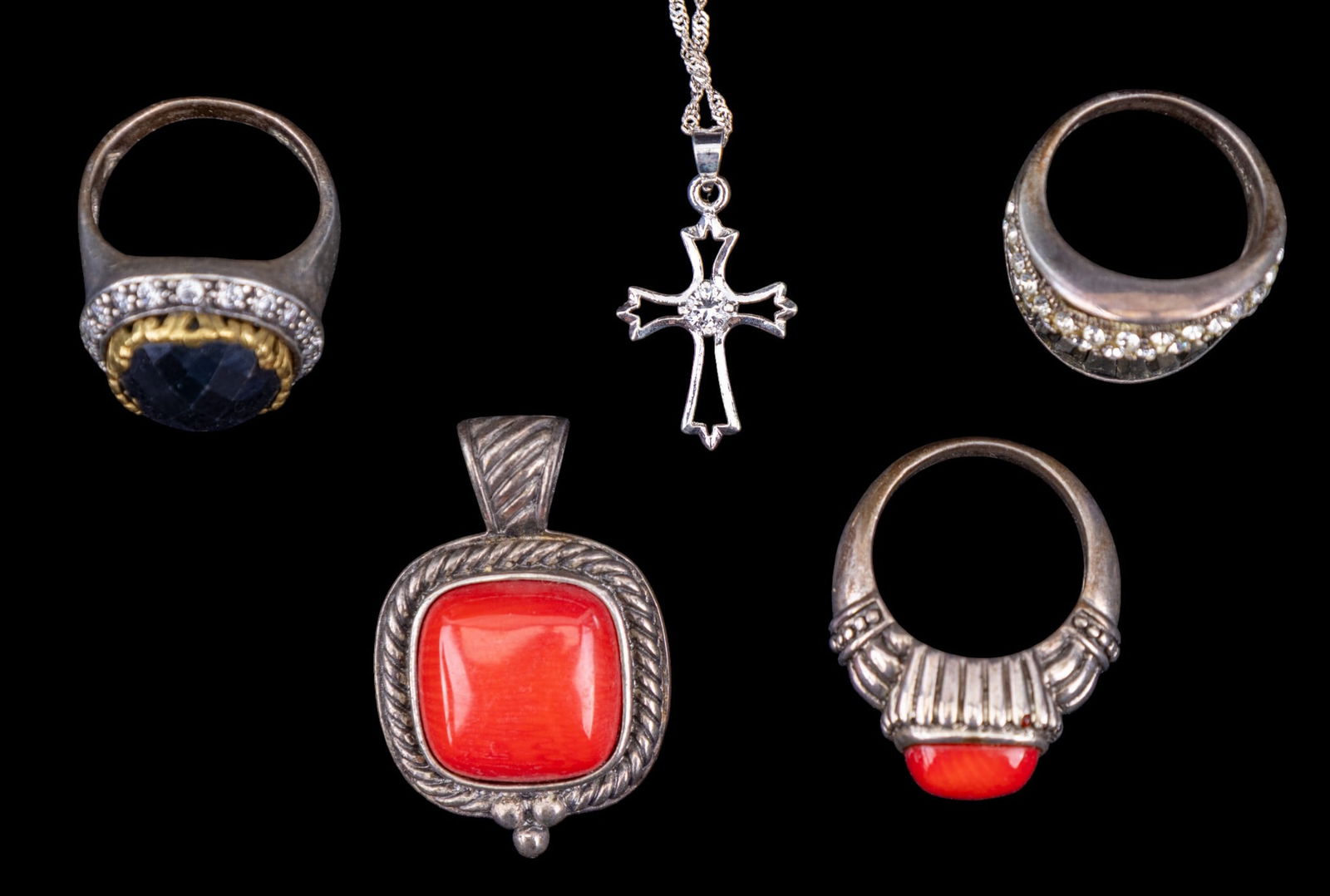 Sterling and Coral Jewelry and More: A collection of sterling silver jewelry including a smooth coral pendant signed 'GSJ' with matching ring, a vintage sterling and rhinestone ring, a sterling and facet cut hematite ring with rhinestone