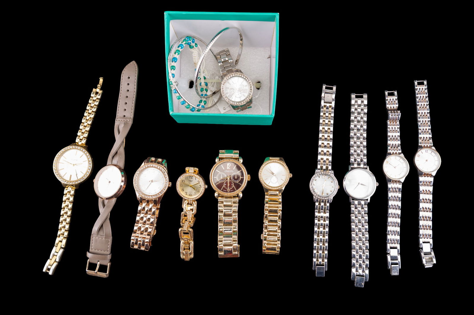 12 Fashion Wristwatches: Twelve ladies fashion wristwatches featuring various makers, including Chico?s and Milano Expressions. Watches include both metallic and embellished designs with quartz movements, some with decorative