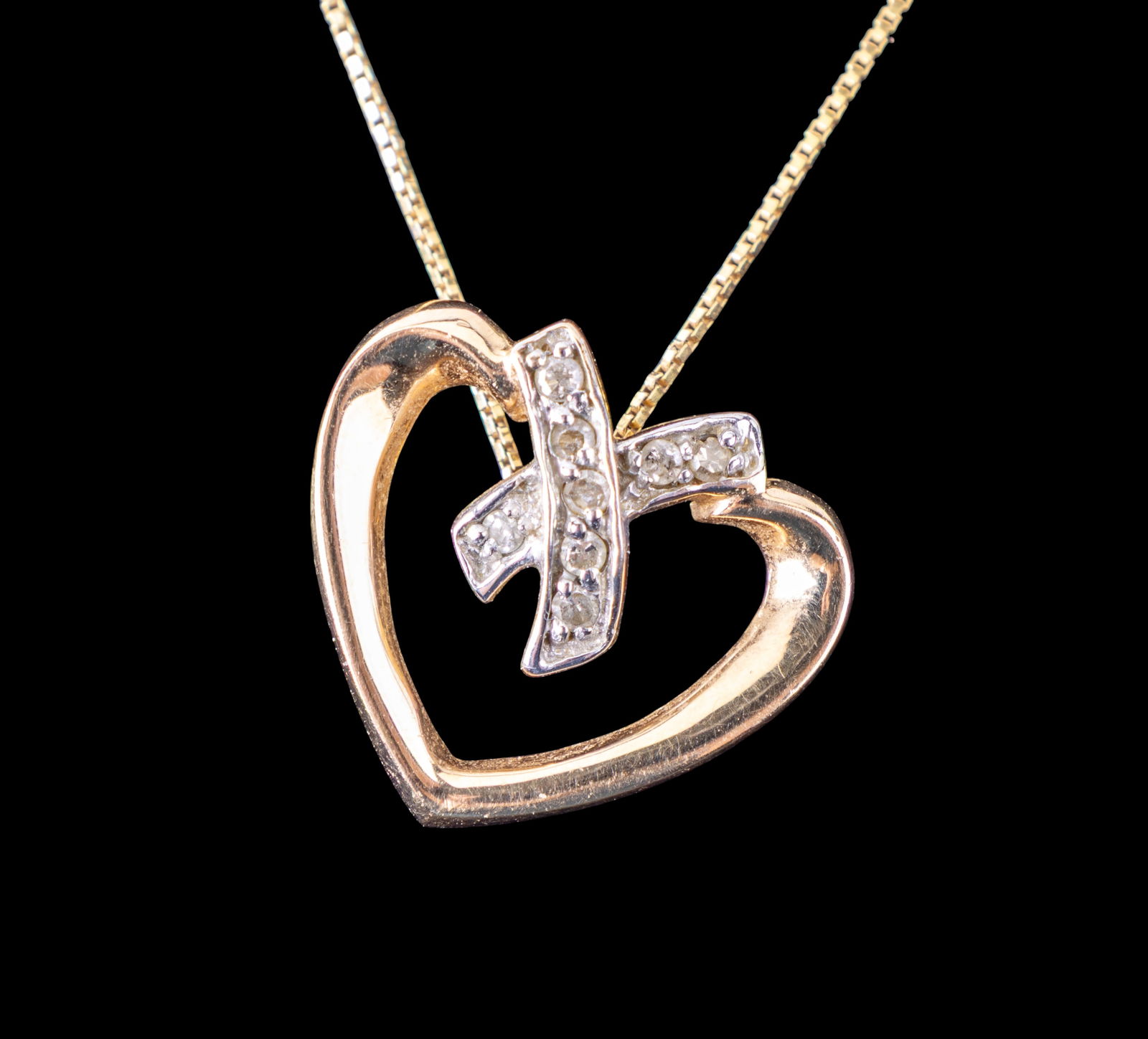 14k Gold Box Chain with 10k Gold Diamond Heart: Box chain made of 14K gold weighing 1.4 grams and measuring 18.5 inches end to end. Features a 10K gold heart pendant with diamond accents weighing 1.7 grams. The chain and pendant show light wear con