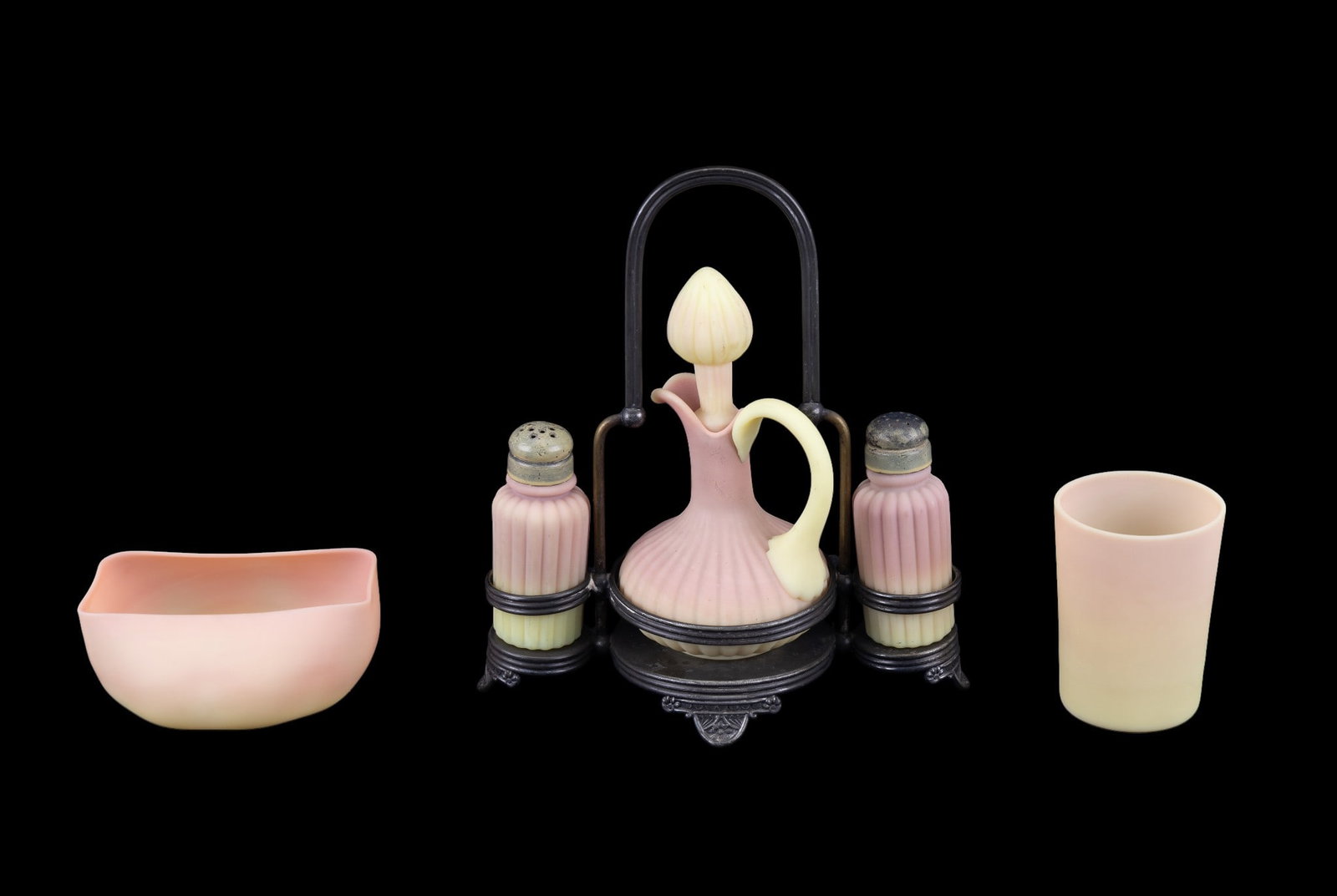 Fenton Burmese Satin Glass Grouping (5 Pc.): A grouping of Fenton Burmese satin glass items in yellow and pink, including a 3.75" tall glass, 2.25" h x 5" w x 4" deep candy dish, and a decanter + salt + pepper set. Decanter measures approx. 6.75