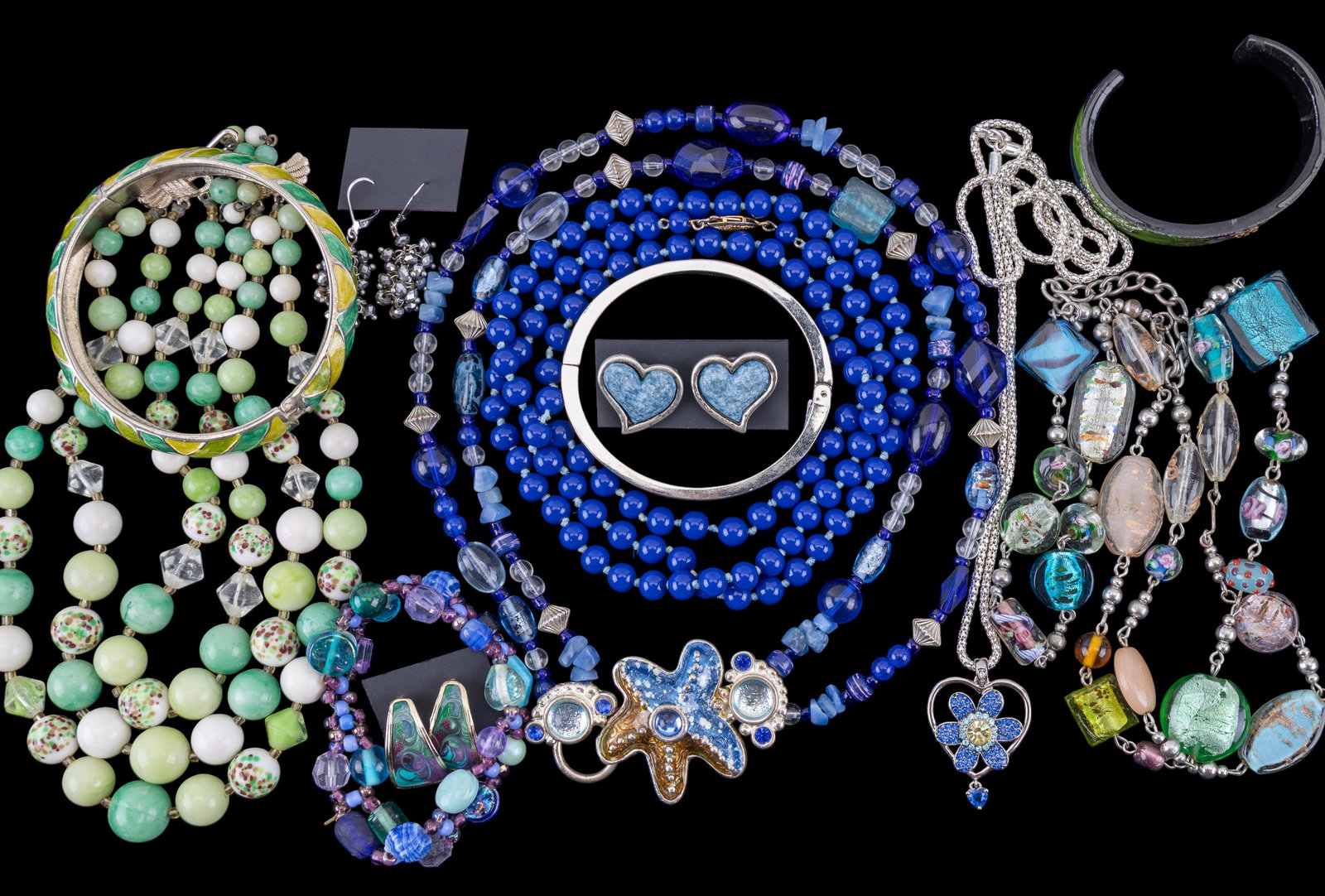 Green and Blue Toned Jewelry: A green and blue collection of costume jewelry with 5 necklaces, 4 bracelets, and 3 pierced earring pairs. Some vintage and hand-made.