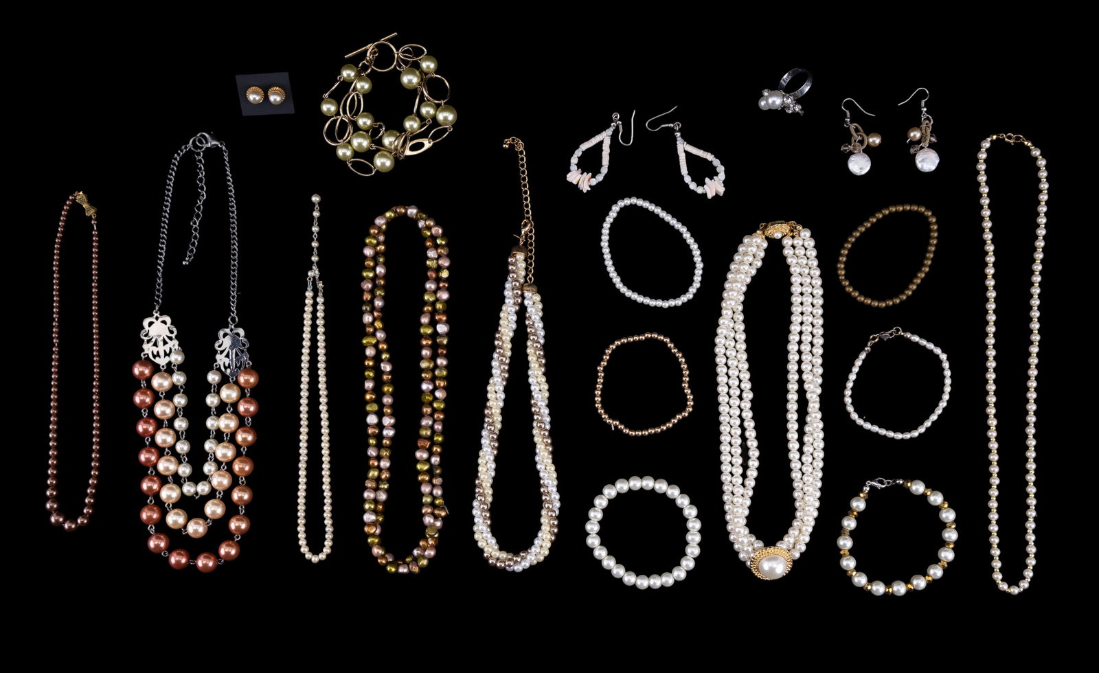Fresh Water and Faux Pearl Jewelry: An 18 piece collection of fresh water and faux pearl costume jewelry with 7 necklaces , 7 bracelets, 3 pierced earring sets, a rhinestone/pearl ring.