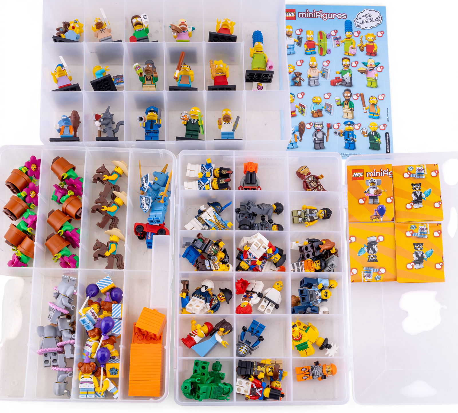 LEGO Minifigures and Accessories: LEGO minifigures and accessories in compartmentalized storage boxes. Includes pieces from various LEGO themes such as The Simpsons, knights, and other figures. Also includes helmets, shields, animals,