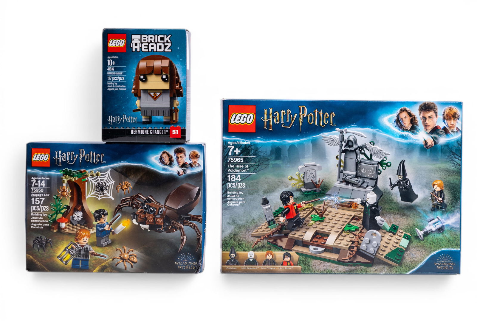 LEGO Harry Potter NIB Sets and BrickHeadz Lot: Three NIB (new in box) LEGO Harry Potter-themed sets: Set 75950 - Aragog's Lair (157 pieces, ages 7-14), Set 75954 - Hogwarts Great Hall (878 pieces, ages 7+), and BrickHeadz Set 41616 - Hermione Gran
