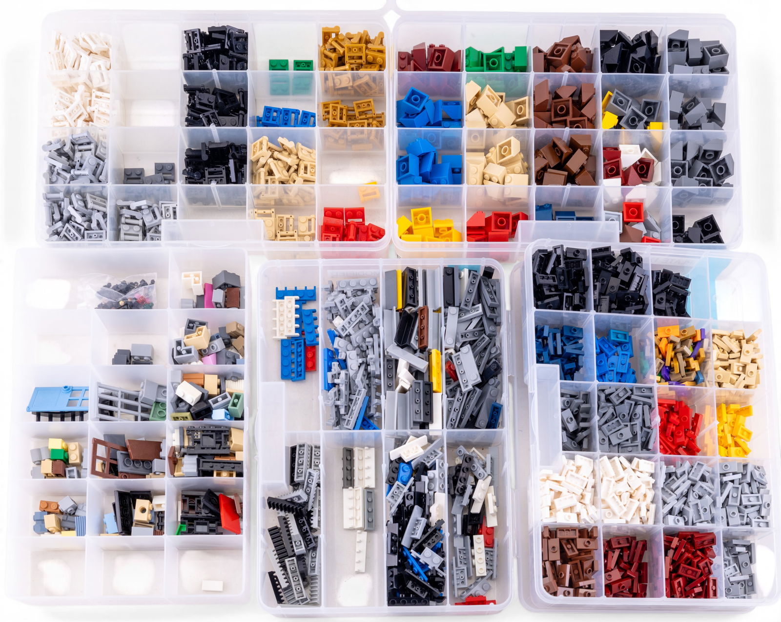 Organized LEGO Parts Assortment in Storage Boxes: LEGO building components stored in clear divided plastic boxes, featuring various labeled compartments with pieces such as 2x2 slopes, corner slopes, 1x4 modified plates, and specialized parts. Includ