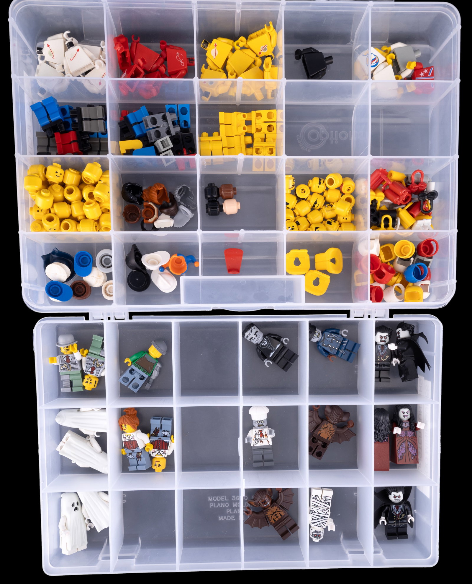 LEGO Minifigure Parts: Monster Hunters and Space: LEGO minifigure parts stored in a divided plastic container. Includes torsos, legs, heads, and accessories. Themes feature Monster Hunters, Space characters, and City figures. Visible are ghost