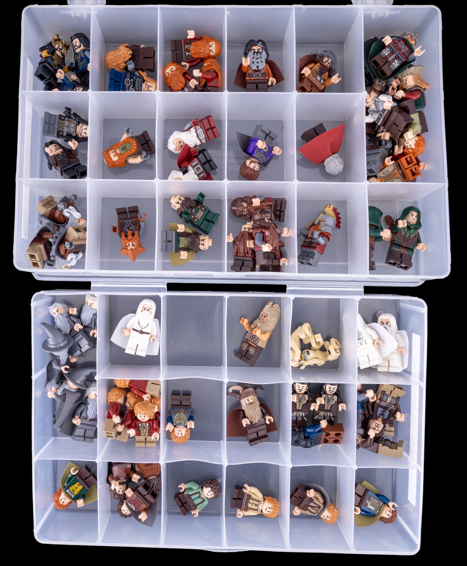 Lego Minifigs From Lord of the Rings, The Hobbit: Lego minifigures inspired by characters from Lord of the Rings and The Hobbit. Includes multiple figures, accessories, and character-specific details. Figures are organized in a compartmentalized