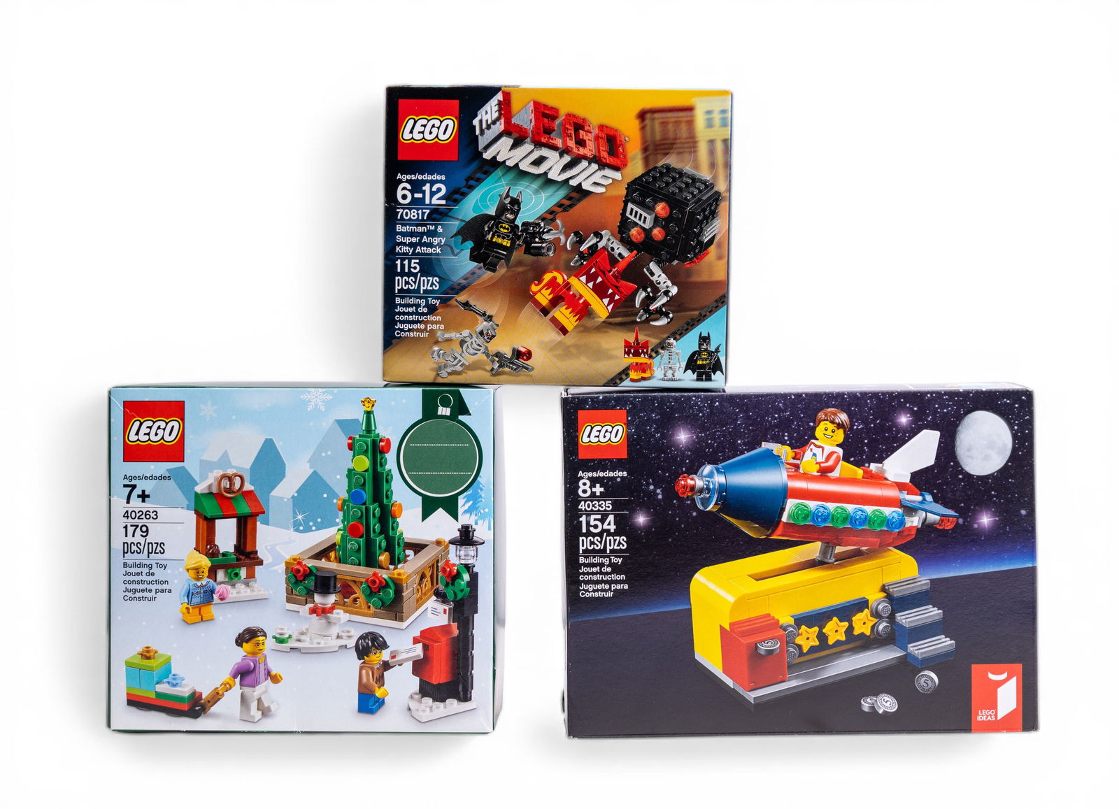 LEGO NIB Holiday and Themed Sets Collection: Three new in box (NIB) LEGO sets including LEGO set 40263 (179 pieces) Christmas-themed park scene, LEGO set 40335 (154 pieces) Rocket-themed carousel, and LEGO Movie set 70817 (115 pieces) featuring