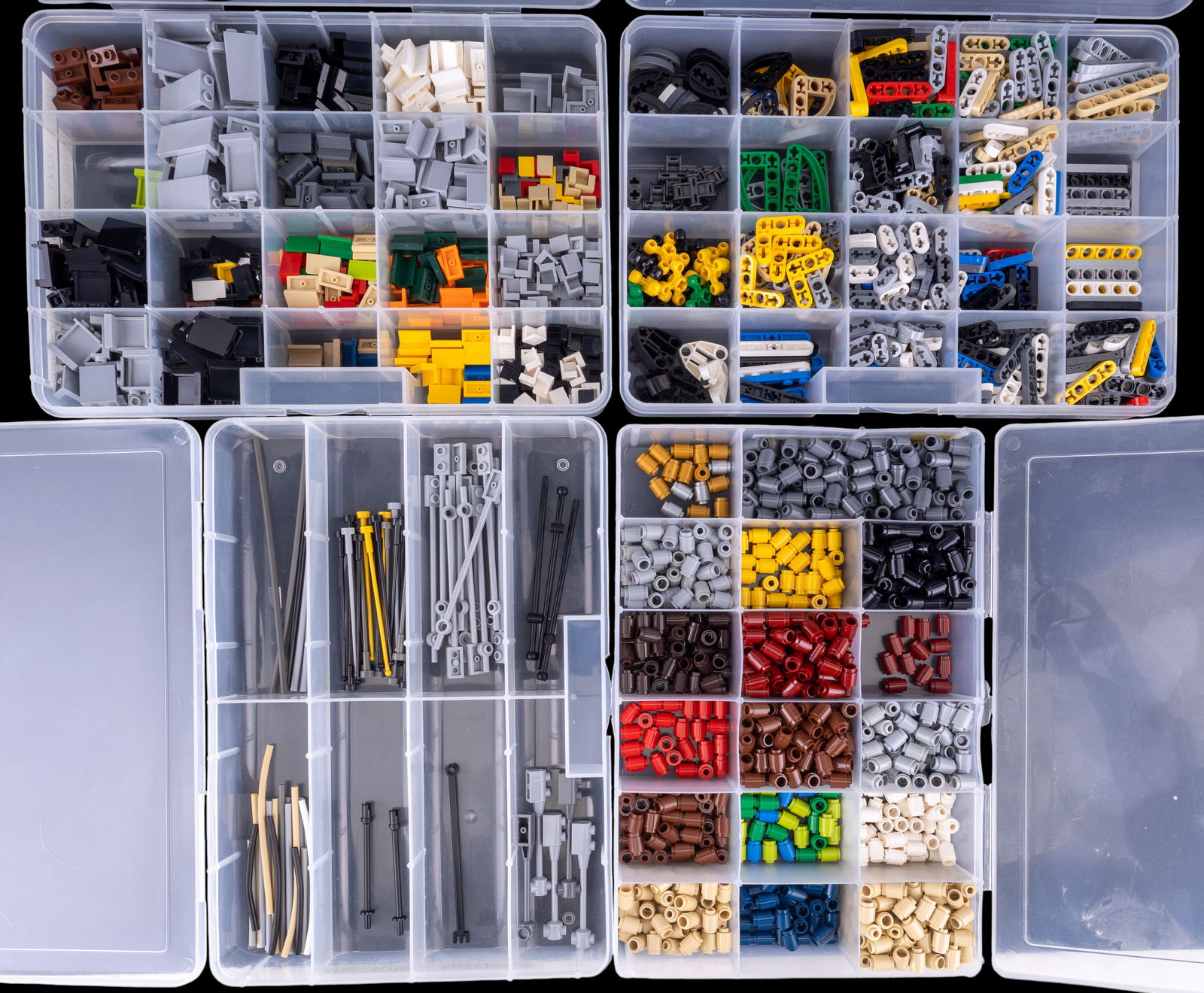 LEGO Technic and Standard Parts in Organizers: LEGO parts stored in labeled, compartmentalized organizers. Includes Technic Lift Arms Thin, 1?1 round bricks in various colors, panel components (1x2x1, 1x3x1, 1?1 corners), and bars, tubes, and ante