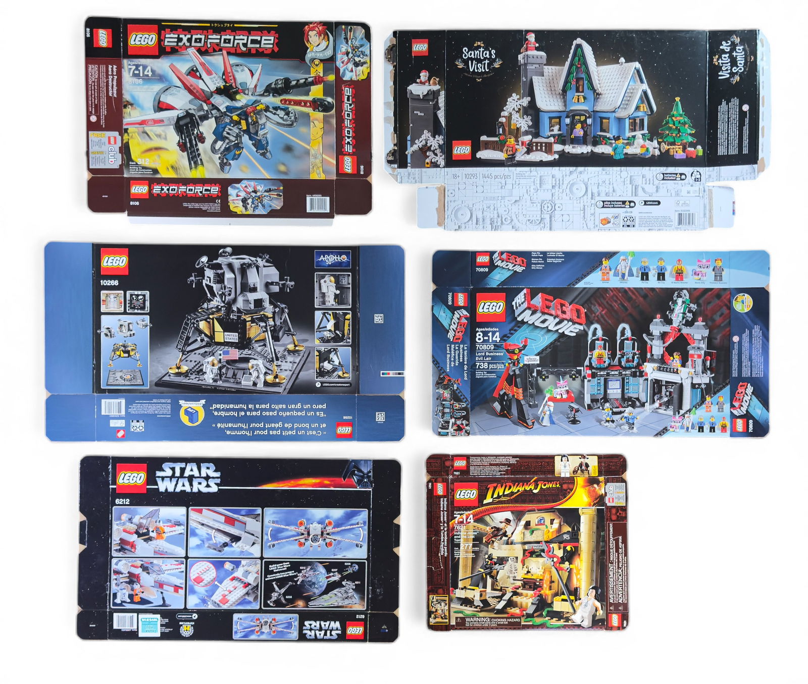 Empty Flattened LEGO Boxes: Six flattened and empty LEGO boxes, including sets from Indiana Jones (7623 Temple Escape), Creator Expert (10266 NASA Apollo 11 Lunar Lander), Santa's Visit (10293), Star Wars X-Wing Fighter (6212),