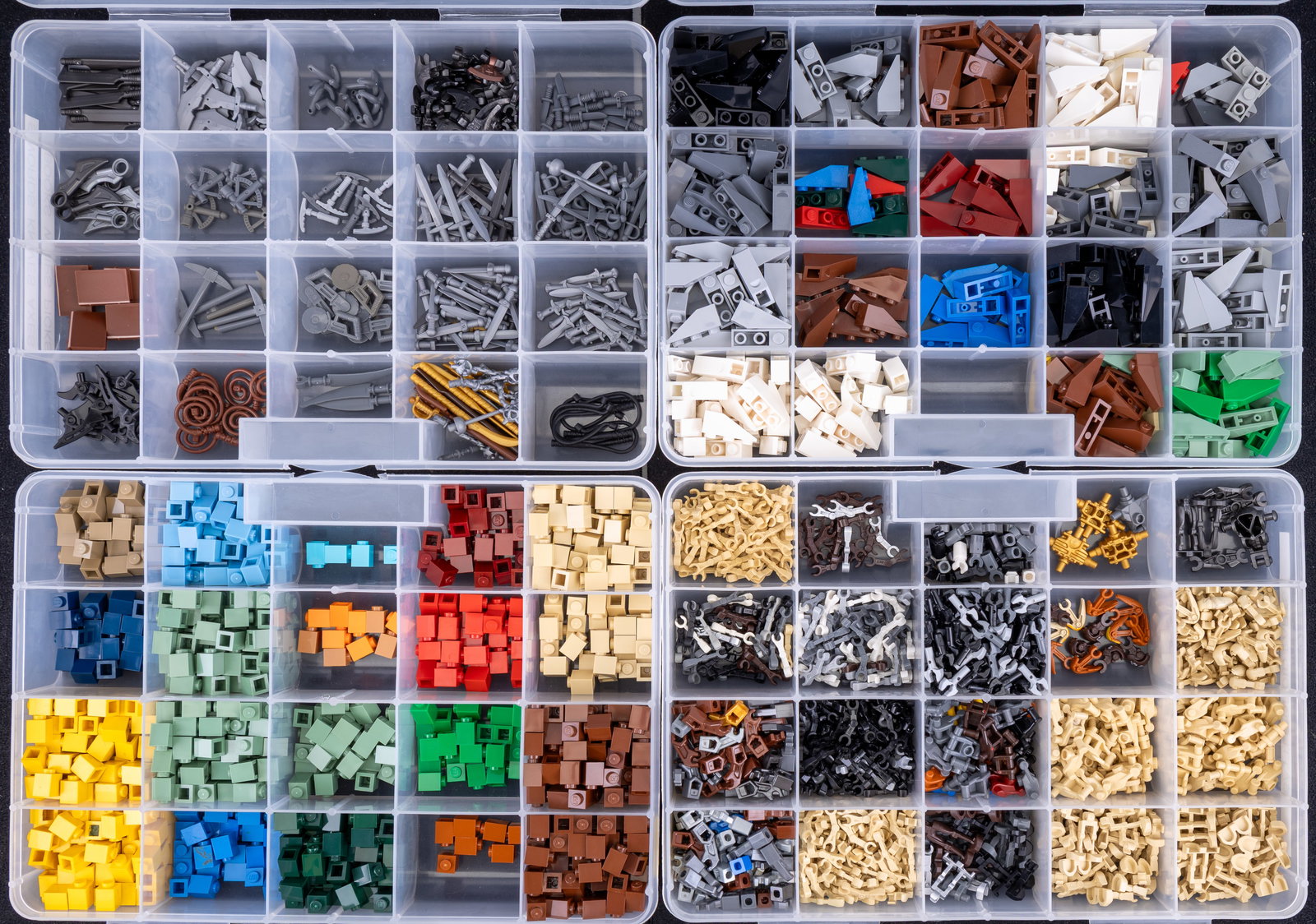 Containers of Assorted LEGO Pieces: Four plastic containers with compartmentalized sections, filled with assorted LEGO pieces. Components include specialized pieces such as 'Battle Droid Parts,' various building elements in different co