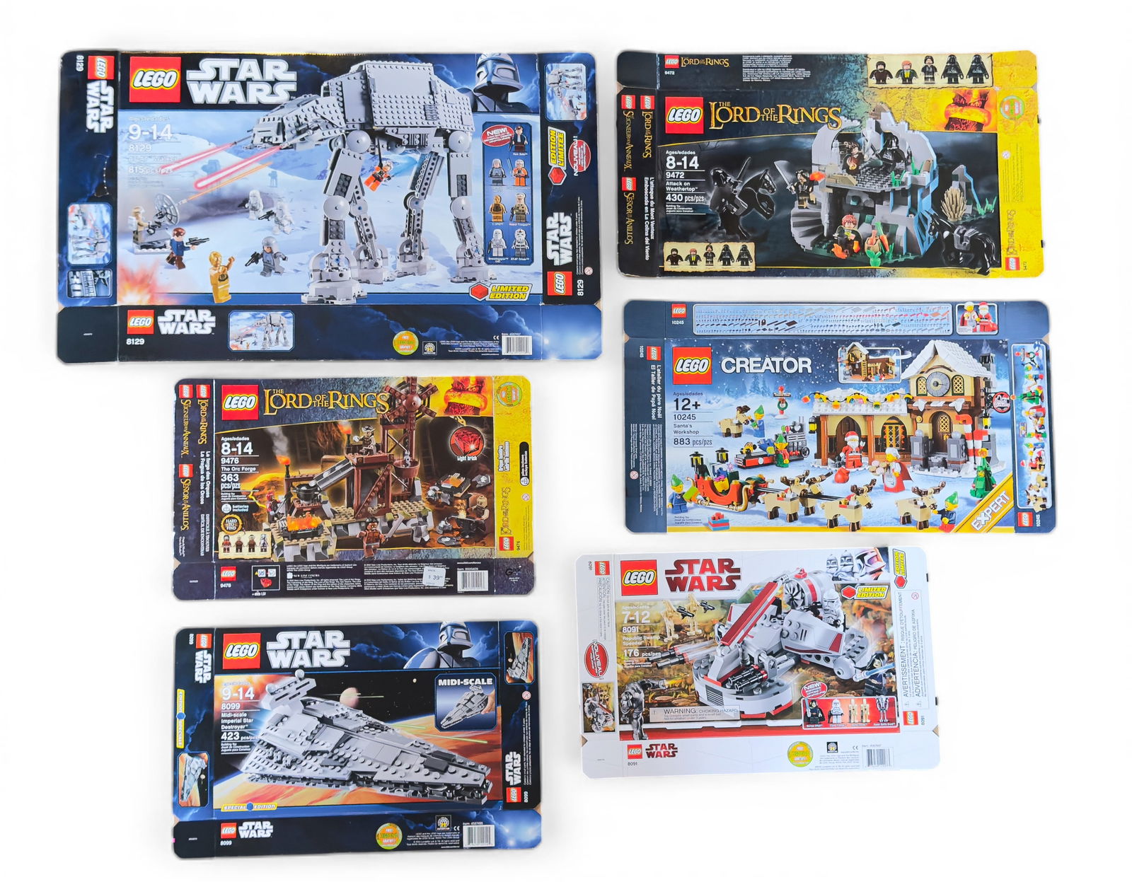 Flattened LEGO Boxes for Multiple Sets, No Pieces: Six flattened, empty LEGO set boxes. Includes Star Wars sets 8099 (Imperial Star Destroyer), 8129 (AT-AT Walker), and 8091 (Republic Swamp Speeder), as well as The Lord of the Rings sets 9476 (The Orc
