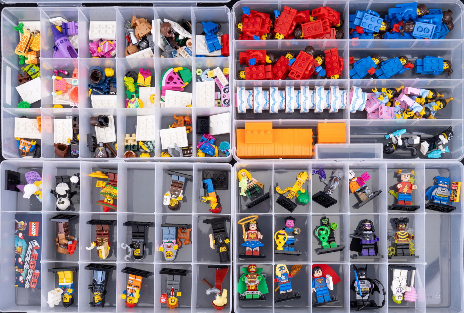 Four Containers of Lego Minifigures: Four plastic containers containing assorted LEGO minifigures and accessories. Includes Series 18 Minifigures labeled extras and a labeled full set of LEGO Movie 2 minifigures. Each container has compa