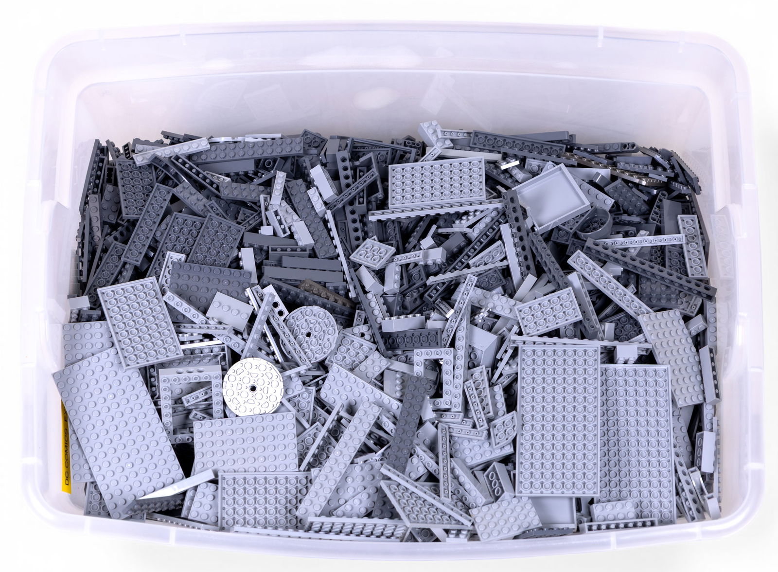 26 Pounds of Grey LEGO Pieces: Approximately 26 pounds of grey LEGO pieces, including a variety of plates, bricks, and structural components. Pieces are stored in a plastic bin, as shown. Suitable for building or completing project