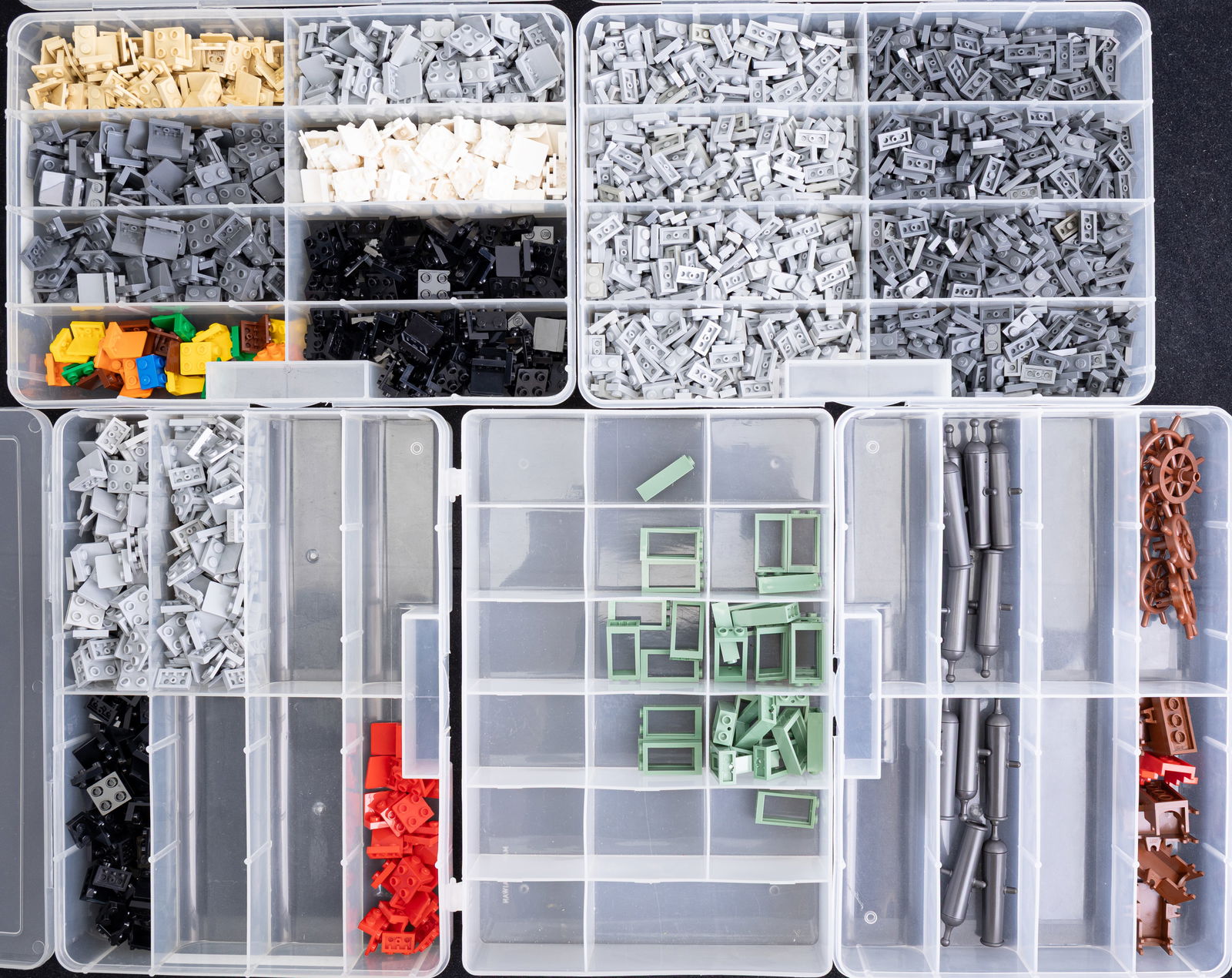 Lego Elements and Accessories: Categorized LEGO elements stored in labeled plastic organizers. Includes 1x2 plates in various colors, ship accessories (wheels, cannons, and carriages), and brackets (1x2/2x2 up and down) in diverse