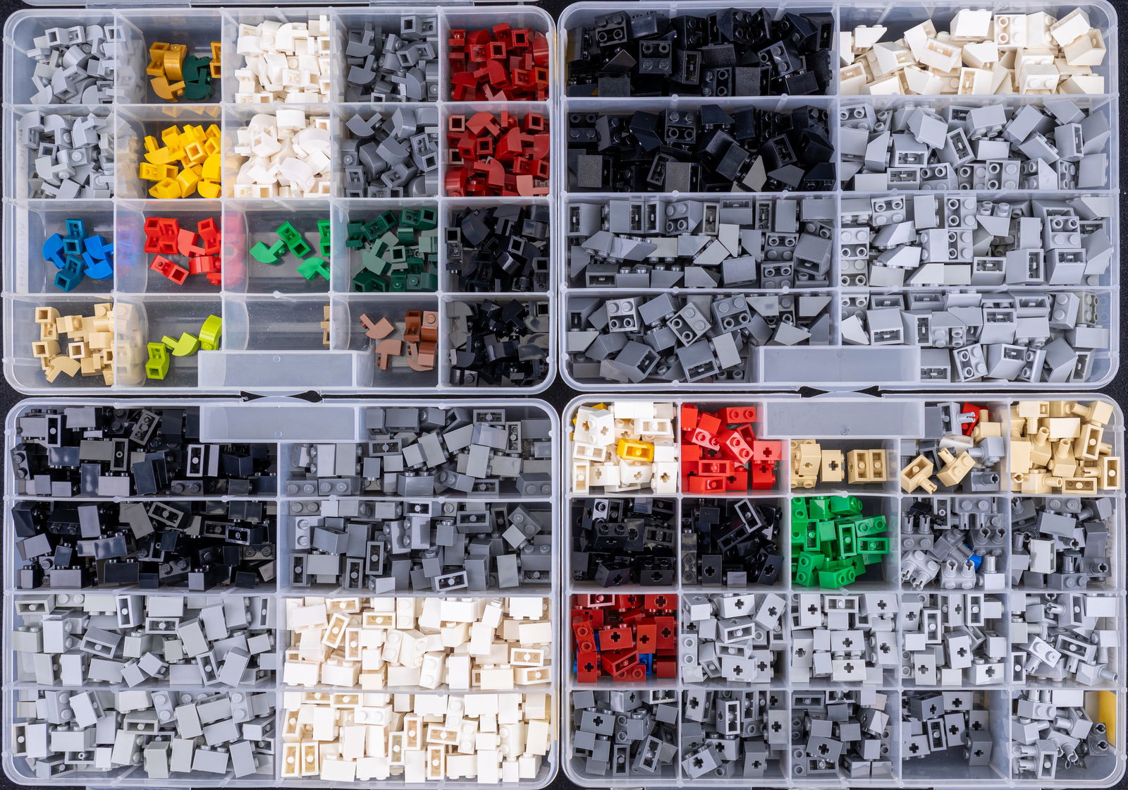 LEGO Brick Pieces in Sorted Container: Multiple compartment organizers containing assorted LEGO brick pieces such as 2x2 reverse slope bricks, 1x1 arch bricks, and 1x2 modified bricks with axle holes. Bricks are sorted based on type, with