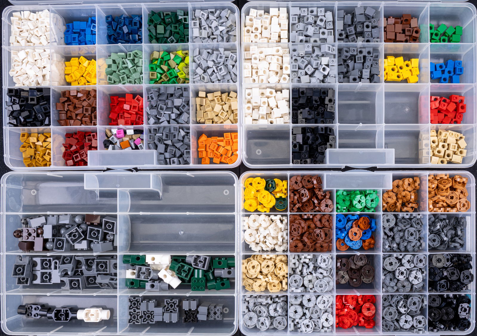 4 Containers of Assorted Lego Pieces: Four plastic containers with assorted Lego pieces organized by type and color. Includes labeled compartments such as 'Brick 1?1 Modified 1 Hole,' 'Brick 2?2 Modified,' 'Plate 2?2 Round,' and 'Slope 1?