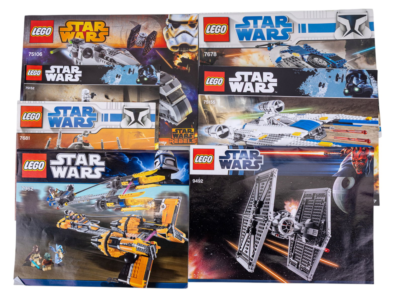 LEGO Star Wars Instruction Booklets / Manuals: LEGO Star Wars instruction booklets, including manuals for sets such as 75060 (Slave I), 9492 (TIE Fighter), 7681 (Separatist Spider Droid), and others. Each booklet displays full-color diagrams and