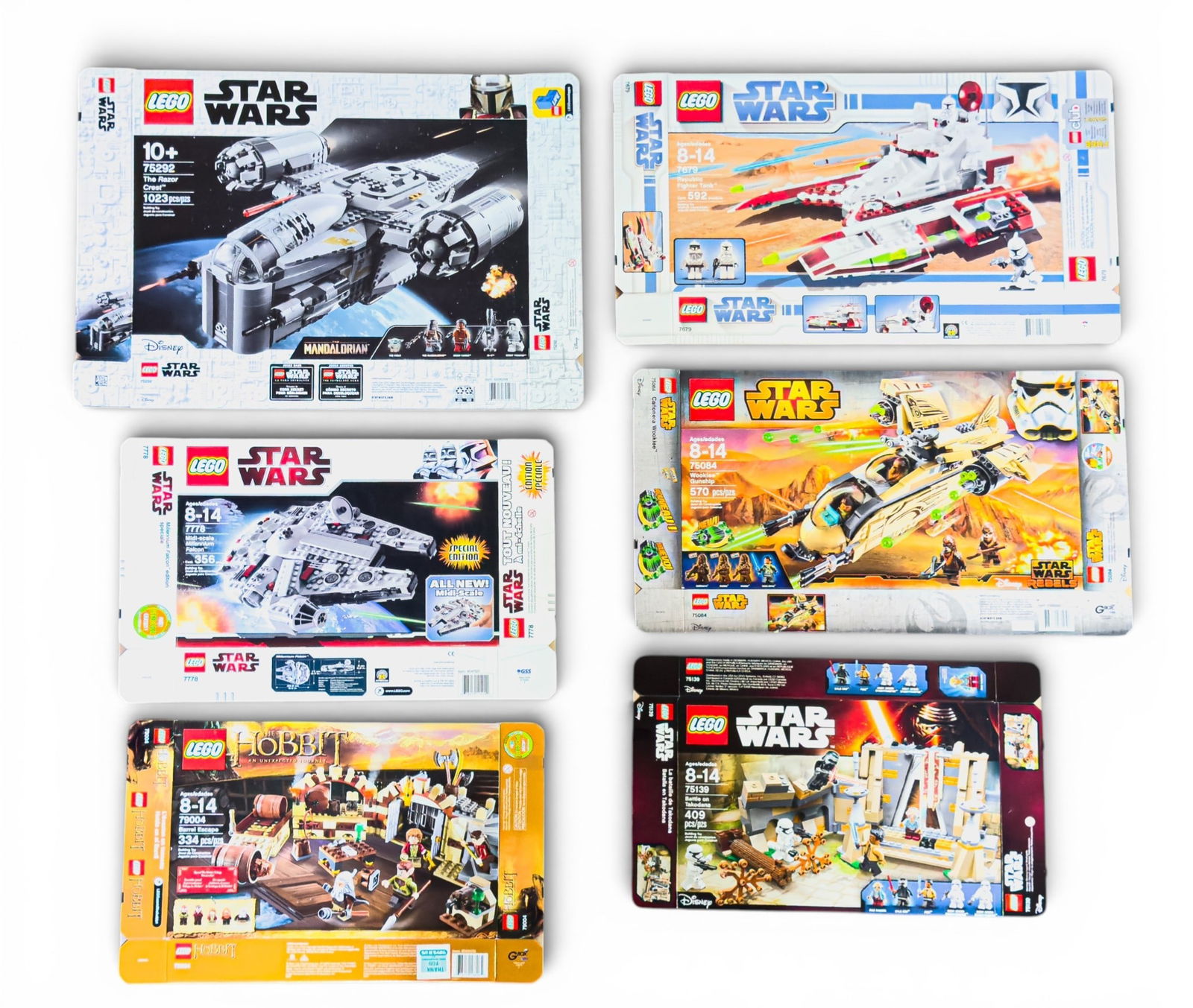 6 Flattened LEGO Boxes - Star Wars & The Hobbit: Six flattened LEGO boxes, featuring sets from Star Wars (sets 75192, 7778, 75139, and two others), and The Hobbit (set 79004). Boxes are flattened and do not include LEGO pieces or instructions.