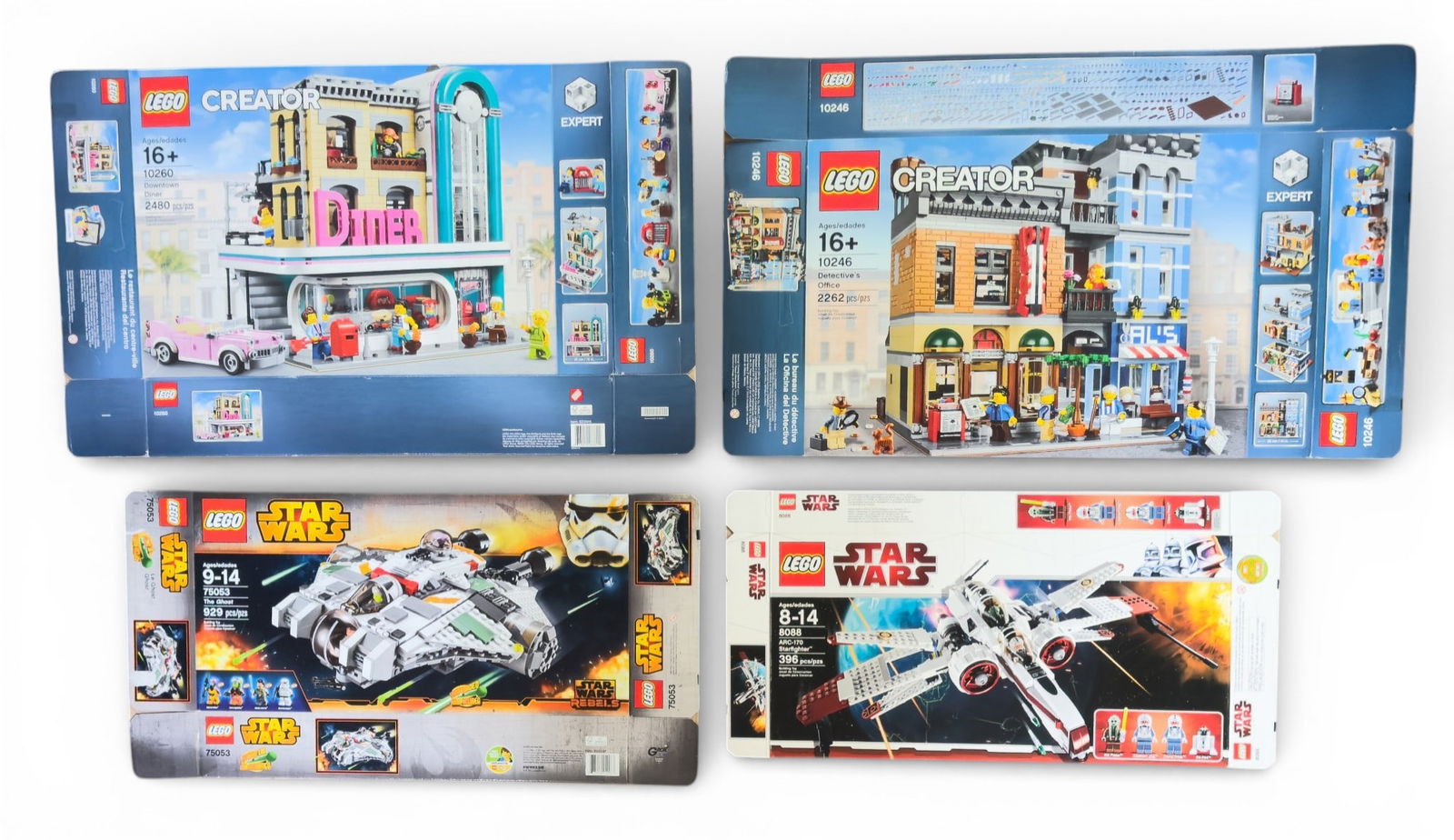 Lego Set Boxes Without Contents: Four empty Lego set boxes including Star Wars set #8088 (ARC-170 Starfighter), Star Wars set #75053 (The Ghost), Creator Expert set #10260 (Downtown Diner), and Creator Expert set #10246 (Detective's