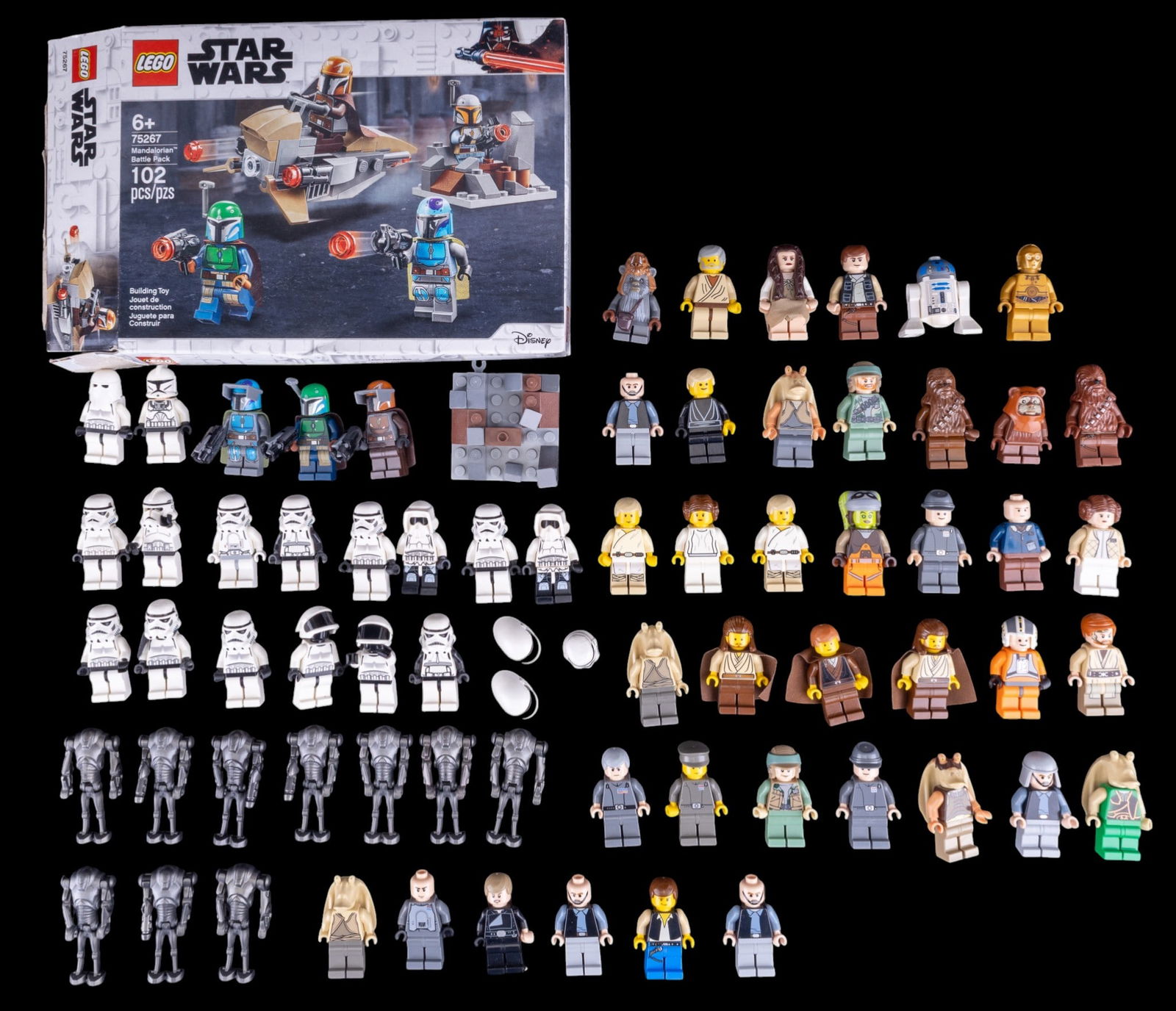Star Wars LEGO Minifigures and Opened Set 75267: Collection includes various Star Wars LEGO minifigures, some with weapons and accessories. Also includes an opened LEGO Star Wars Set #75267 (Mandalorian Battle Pack, 102 pieces). Contents of the box
