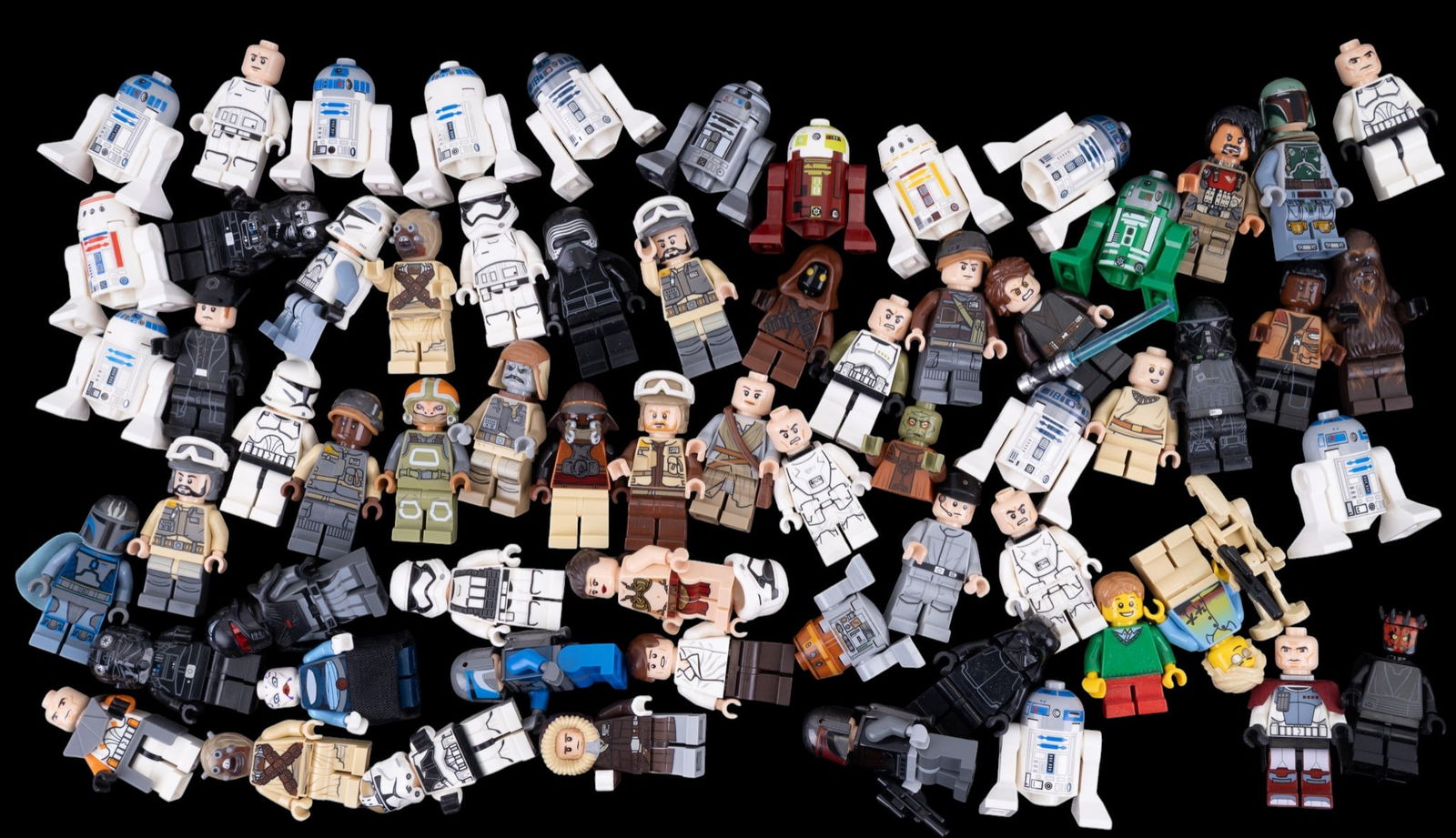 LEGO Star Wars and Other Minifigures: Includes characters from the Star Wars franchise alongside others. Various costumes and accessories are present, with some figures including helmets, capes, and printed details indicative of specific