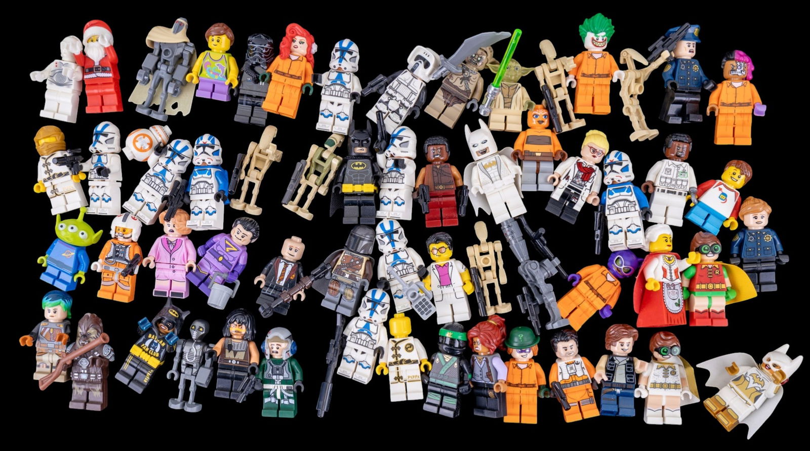 LEGO Minifigures Collectibles: LEGO minifigures, representing various themes, including Star Wars, DC Comics, Ninjago, Disney, Christmas, and Fantastic Beasts. Features characters such as Jedi, Sith, superheroes, holiday figures, a