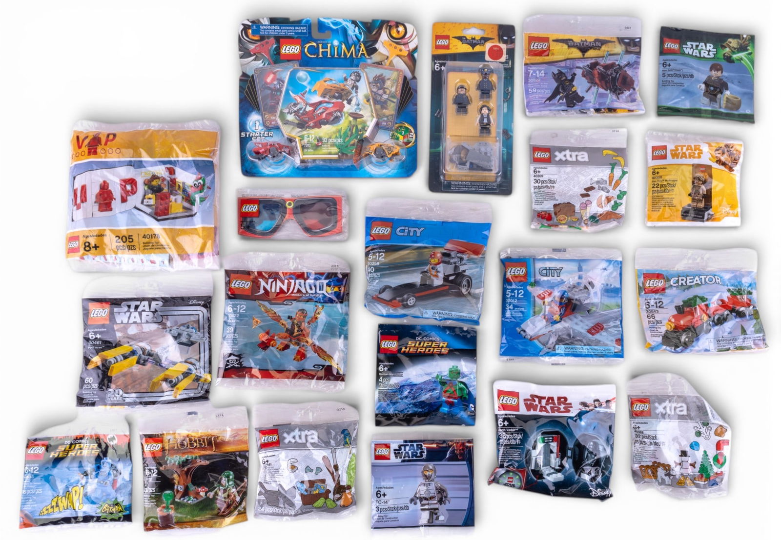 Sealed Lego Bags and Sets: Approximately 20 unopened Lego bags, including mini-figure packs, accessories, and small sets. Includes themes such as Lego Ninjago, Star Wars, Chima, and Batman Movie sets. Items appear to be sealed