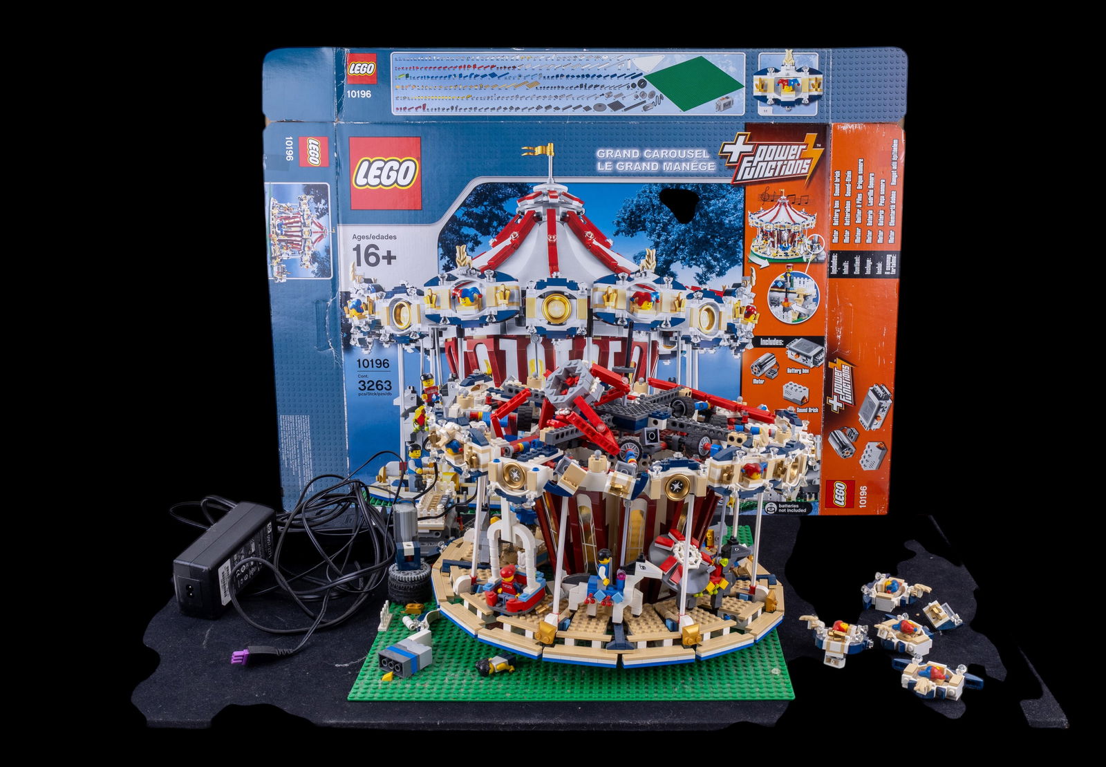 Lego Grand Carousel Set 10196 with Box: Incomplete Lego Grand Carousel (set 10196) with original box. The set is sold as found and is not guaranteed to include all pieces. Box displays moderate wear, and components are loose within the box.
