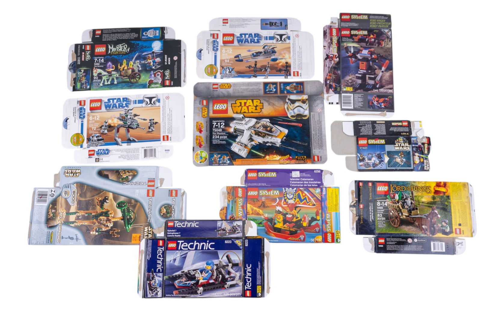 10 Empty LEGO Boxes: 10 empty LEGO boxes featuring various themes: Monster Fighters, Star Wars Technic, System, and Lord of the Rings. Boxes include set numbers such as 9462, 75048, and 8000. Assorted sizes and conditions