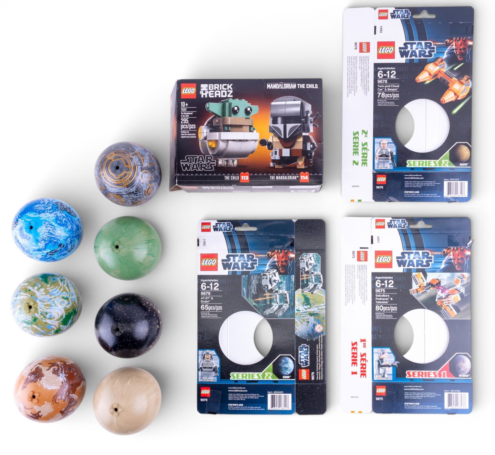 LEGO Star Wars and BrickHeadz Figures: Previously opened LEGO Star Wars planet-themed collectibles and assembled LEGO BrickHeadz figures of The Mandalorian and The Child. Planet-themed LEGO items feature packaging and plastic planet pieces