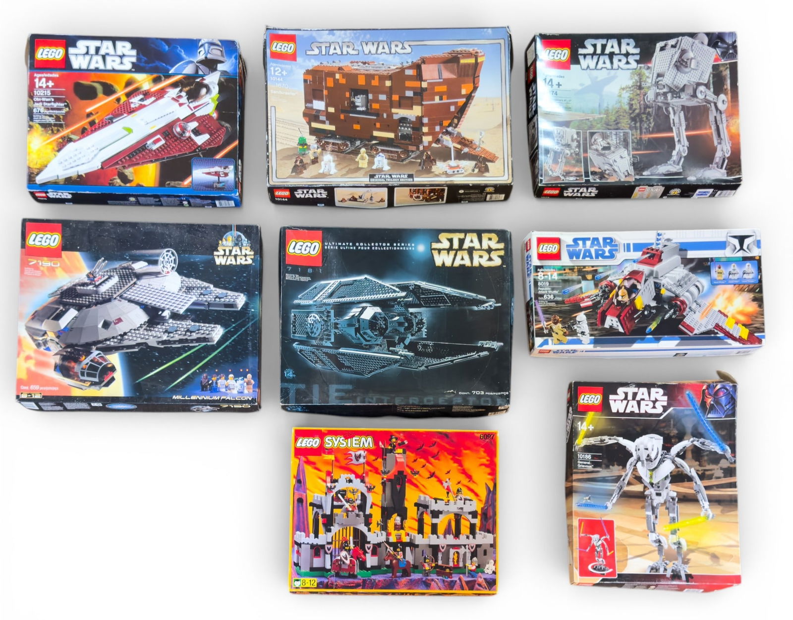 LEGO System and Star Wars Empty Boxes: Empty LEGO set boxes, includes multiple LEGO Star Wars sets such as 'General Grievous' (10186), 'Millennium Falcon' (7190), 'Obi-Wan's Jedi Starfighter' (10215), 'TIE Fighter' (7181), 'AT-ST' (10174),
