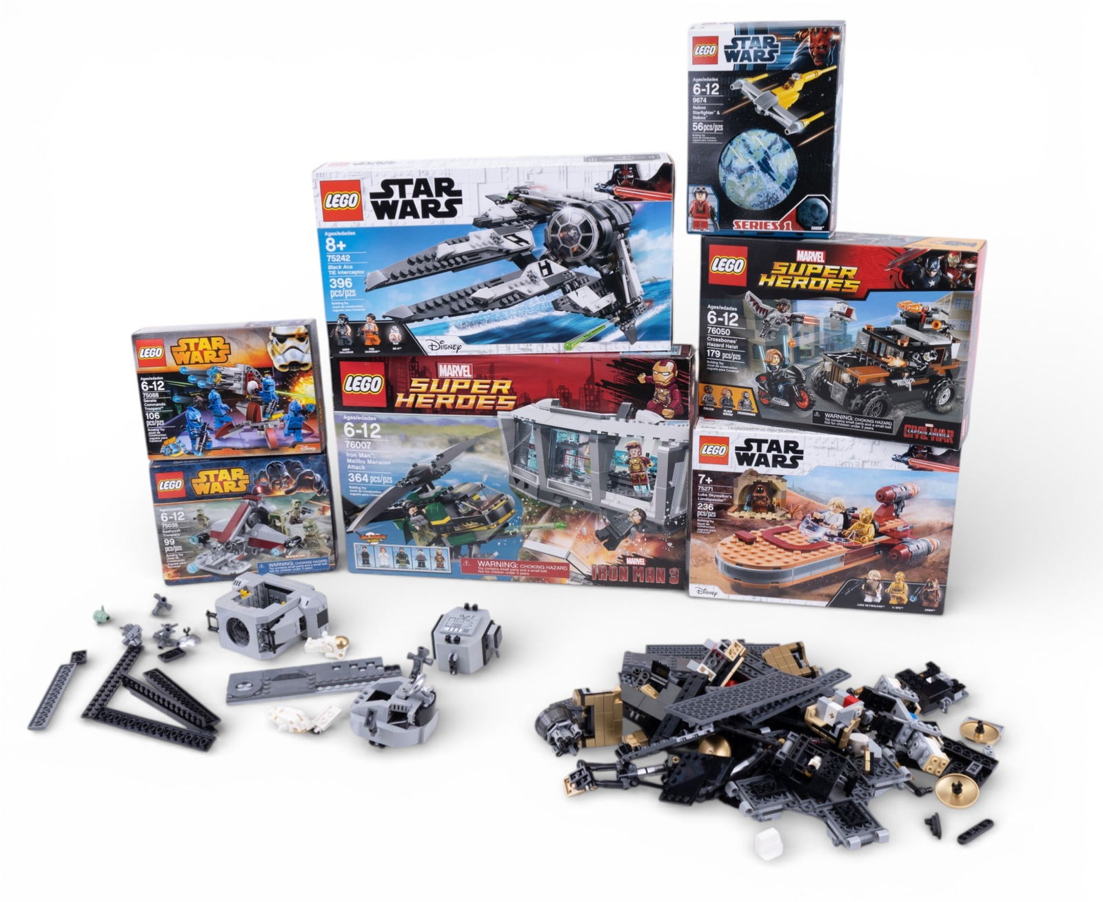 LEGO Star Wars and Super Heroes Sets, Mixed: A mix of LEGO sets featuring Star Wars and Marvel Super Heroes themes, some partially assembled or disassembled. Boxes include Star Wars 9674, 75271, 7679/7888, and Marvel Super Heroes 76050. Contents
