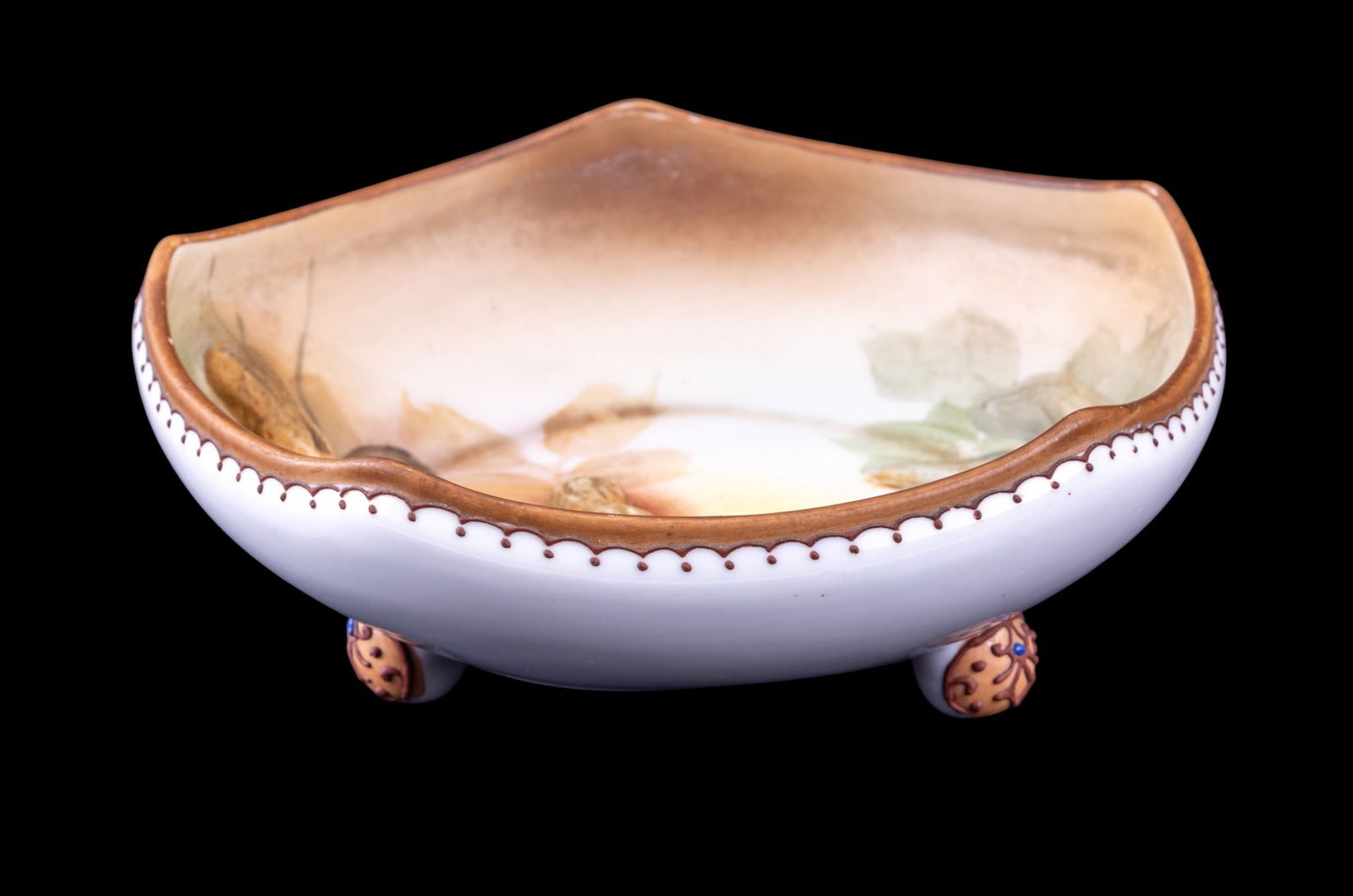 Nippon Painted Porcelain Peanut Bowl, Trifoot: Hand painted Nippon porcelain peanut bowl featuring figural porcelain peanuts in the main design of the interior of the bowl, measures approx. 7" diam x 2.5" H
