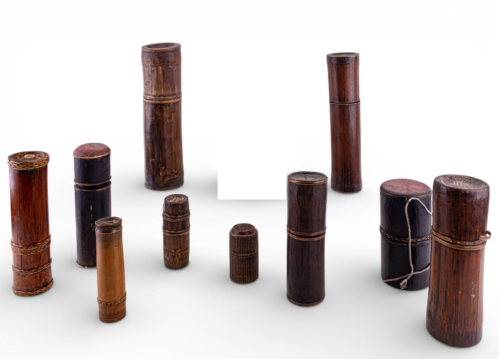 Early Korean Bamboo Brush Pots (10): A collection of 10 early Asian bamboo brush pots / containers with lids, varying sizes, various designs, some painted. Smallest measures approx. 4" H x 2" diam. and the largest measures approx.