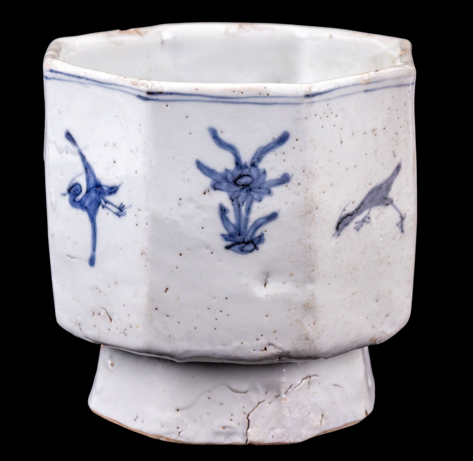 19th C Korean Octagonal Footed Bowl: A fine and rare 19th C Korean footed porcelain bowl depicting flowers and birds, note some glaze skips and wear due to age. Measures approx. 5" W x 5.5" D x 4.75" H.