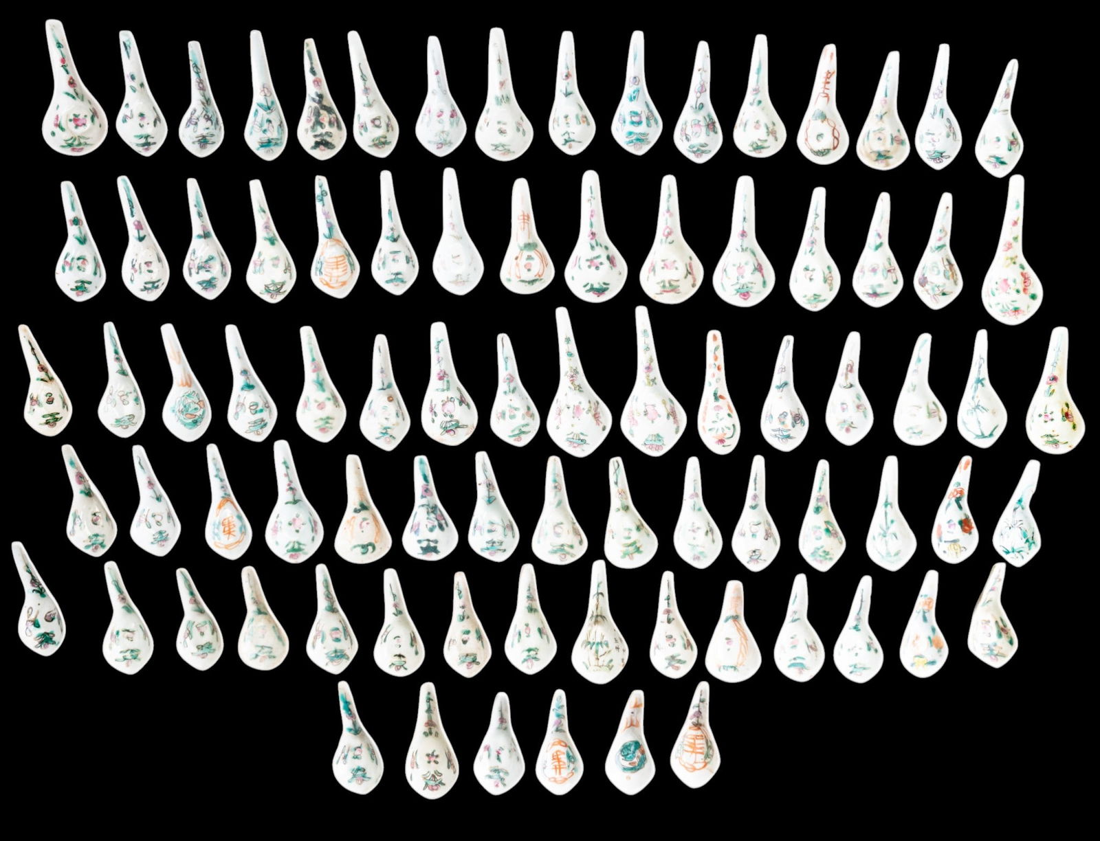 Large Group of Chinese Famille Rose Spoons: Group of approx. 60 Chinese porcelain soup or tea spoons decorated in the Famille Rose palette with floral and foliate motifs in green, pink, and iron red on a pale ground.
