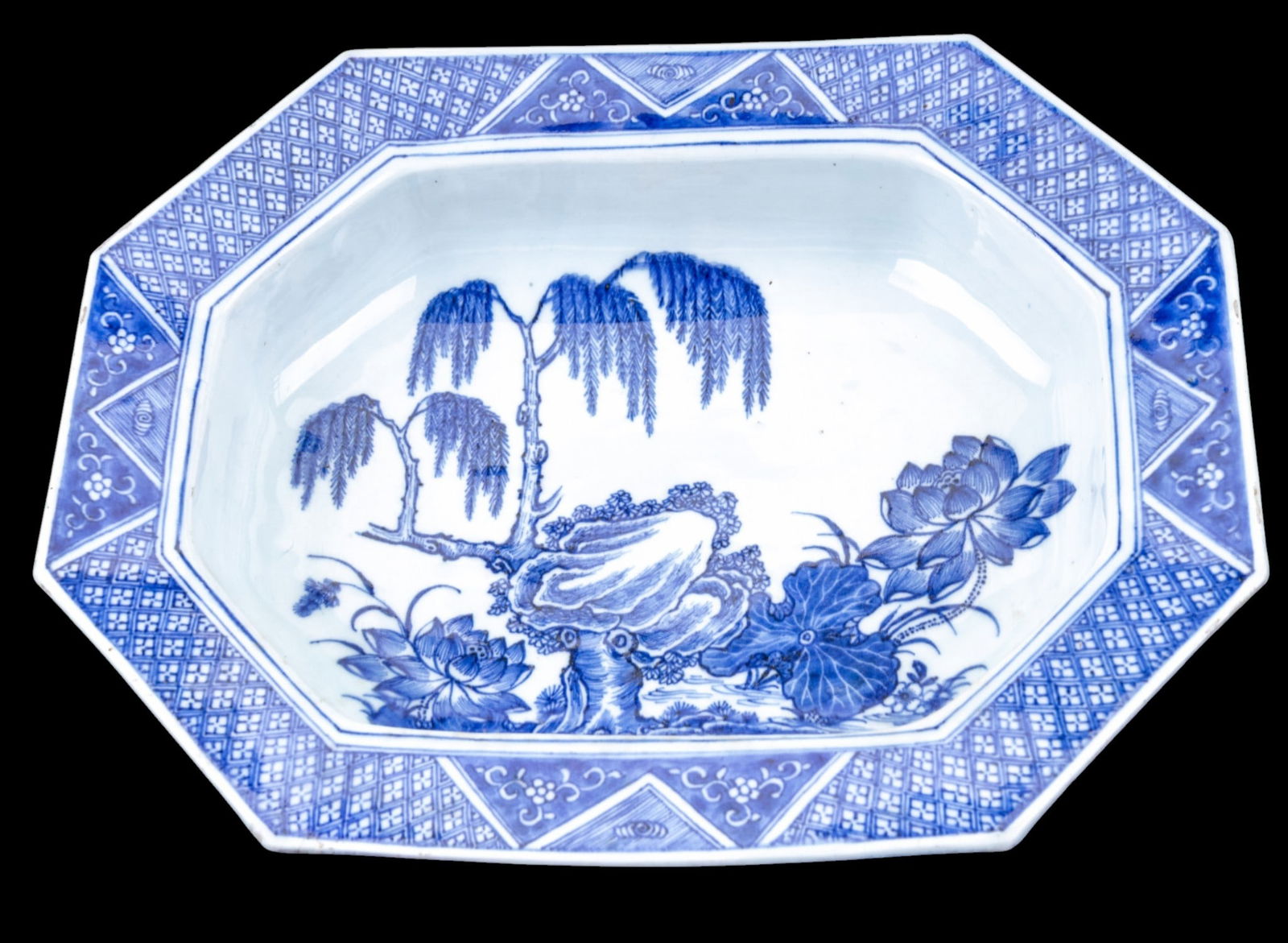 19th C Japanese Octagonal Bowl: 19th century Japanese blue and white porcelain octagonal bowl / dish, decorated with hand-painted floral and landscape motifs. Measures approx. 3" Tall x 15" x 12.25".
