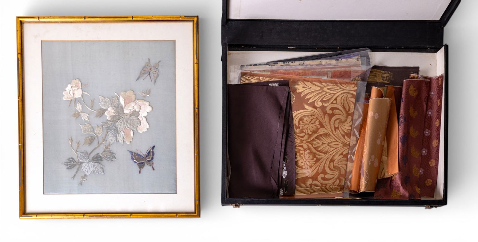 Framed Asian Silk Embroidery, Fabric Remnants: An Asian silk embroidery set in a bamboo-style gilt frame depicting butterflies surrounding a group of flowers, accompanied loose fabric remnants of various colors and materials. Frame measures