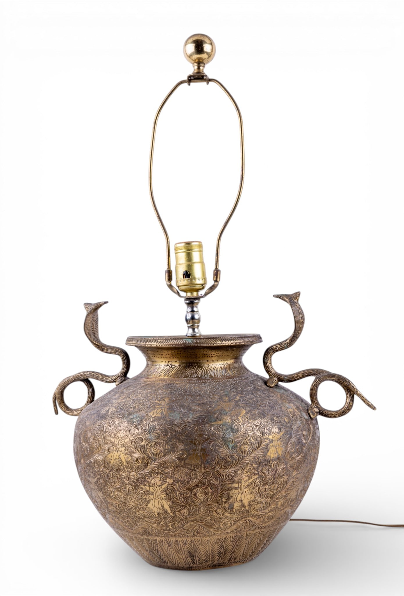 Embossed Brass Lamp Conversion with Handles: Antique brass embossed lamp likely converted from a traditional vessel. Design features intricate floral motifs and what appear to be Persian-style engravings. Twin handles extend outward, possibly