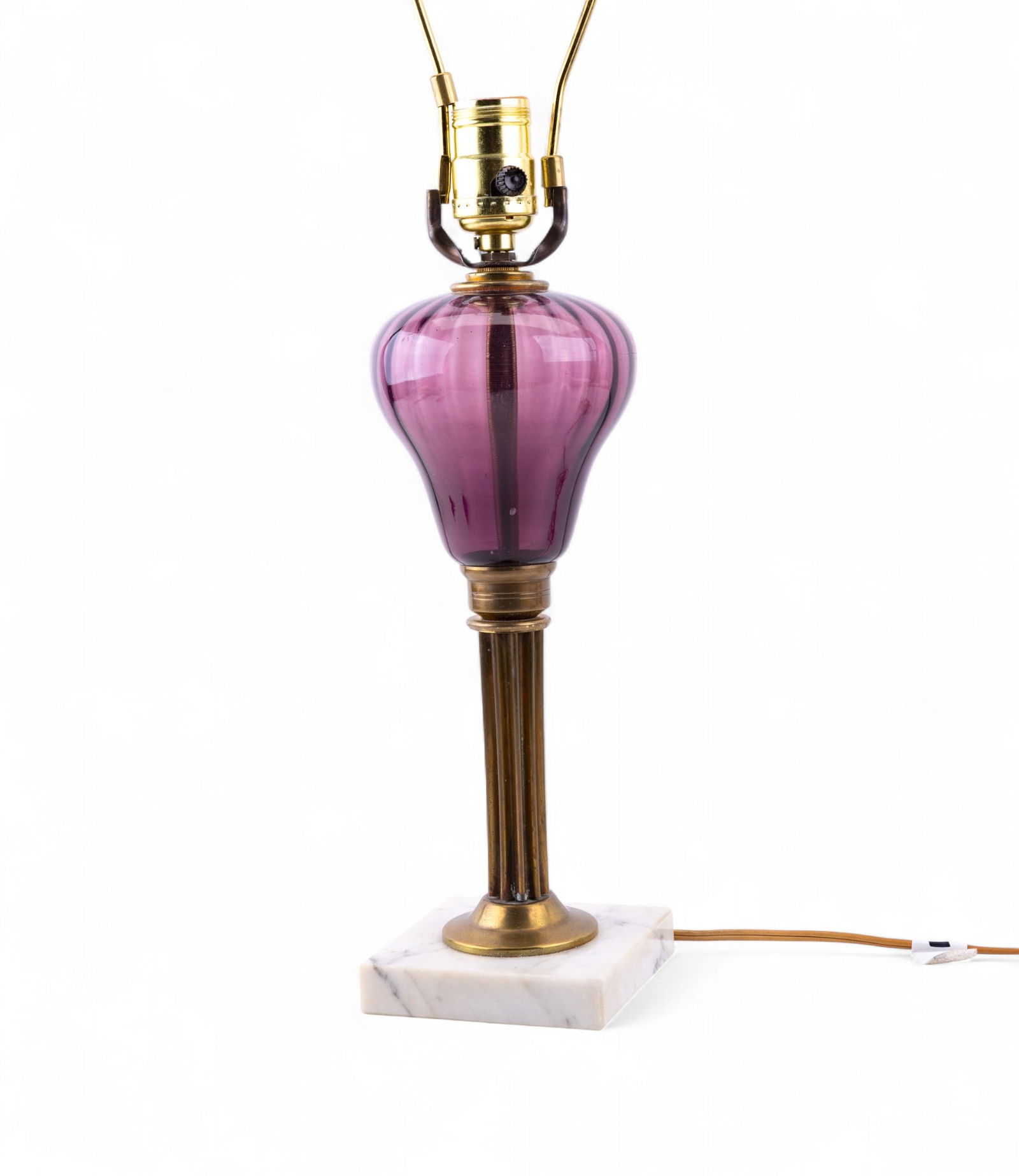 Antique Pedestal Lamp w/ Purple Glass Body: An early vintage pedestal banquet lamp featuring a fluted brass stem , blown purple / amethyst colored glass body, and square marble base, untested, measures approx. 14" to the socket, 23" H to the