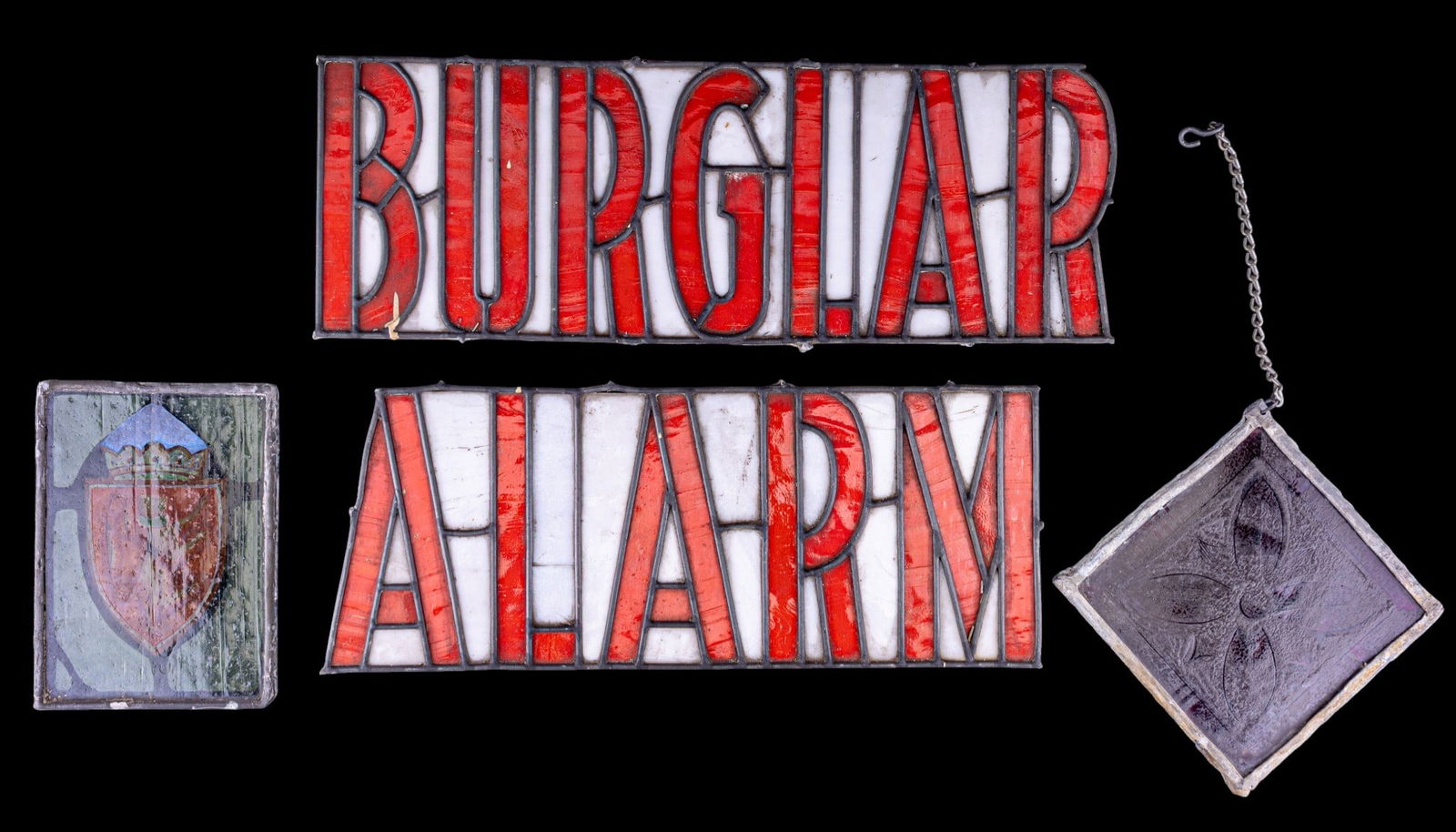 Vintage Leaded Stained Glass Window Sign: 2 pc Vintage leaded stained glass sign panel reading "BURGLAR" and "Alarm" respectively, executed with red and white glass segments. May require mounting, slightly unstable. Accompanied by 2 earlier