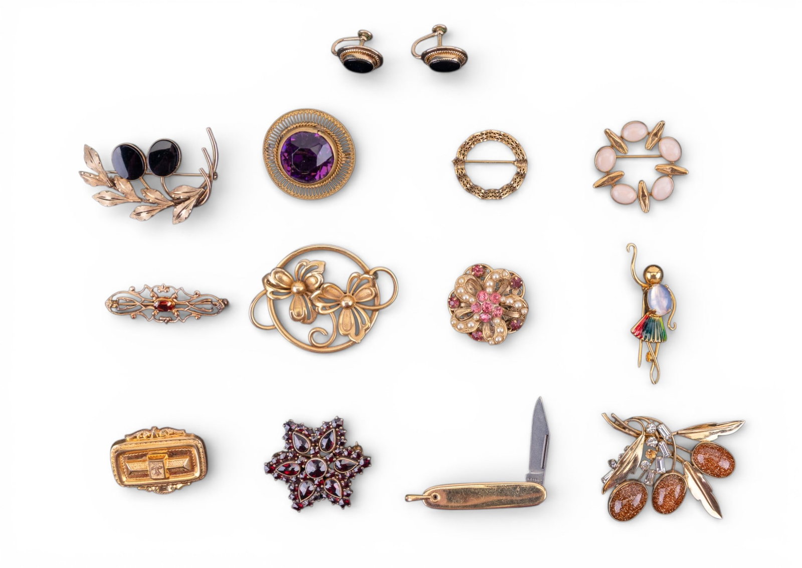 Vintage and Victorian Gold Filled Jewelry: A collection of vintage and Victorian 12K gold filled jewelry including brooches, screw back earrings, and an Imperial fob chain collapsible knife. Designs feature sandstone, rhinestones, enamel,