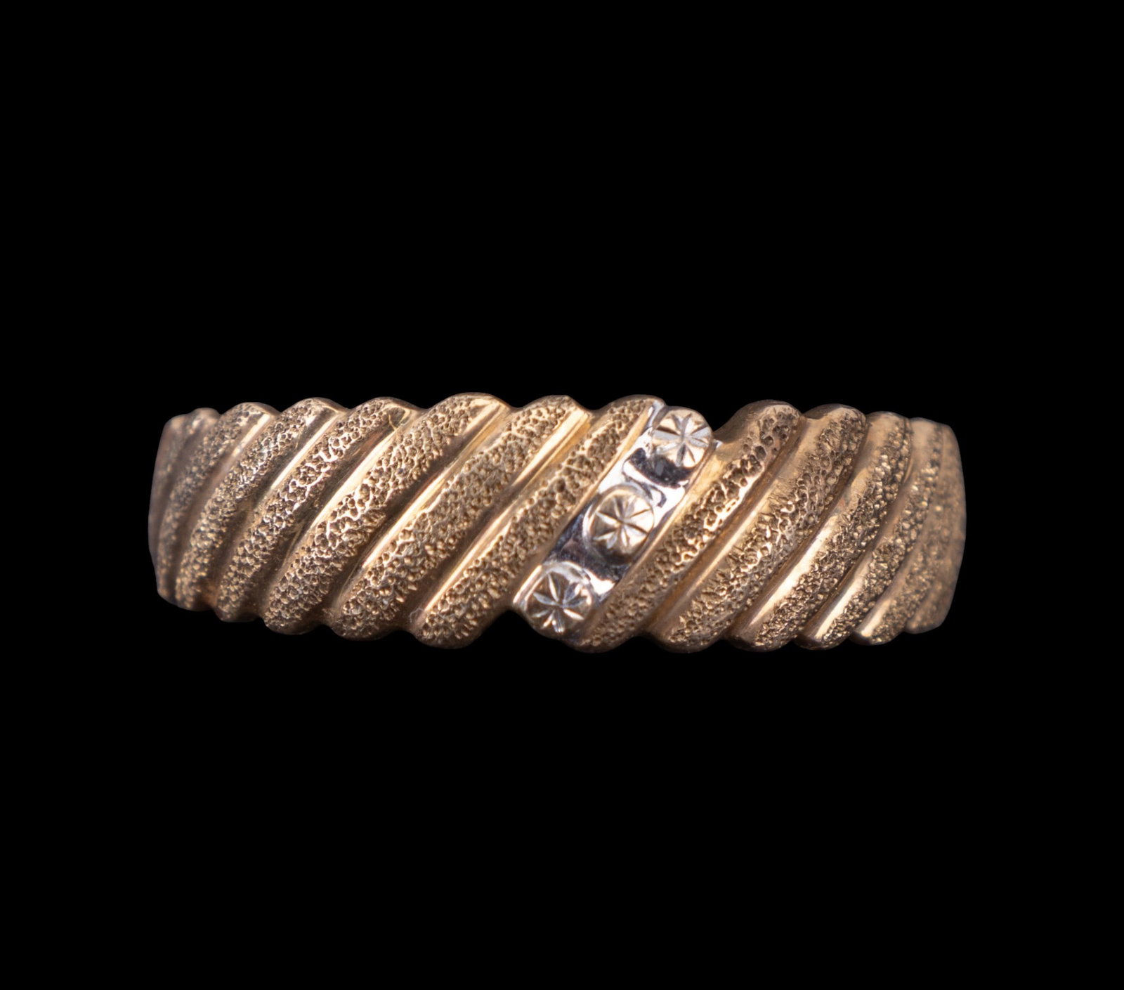 10k Yellow Gold Decorative Ring: A 10k yellow gold decorative ring with textured exterior in size 10.5 and weighing 3 grams.