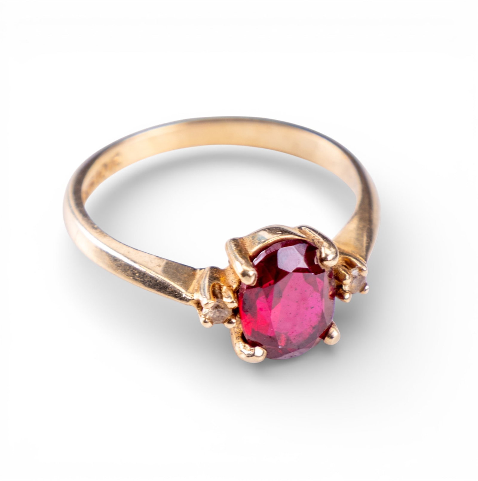 10K Gold Ruby Ring by B&F Baden Foss: A 10k gold ring marked "B&F 10K" (B&F likely Baden and Foss) with 6mm x 7mm central ruby and 2 small clear stones. Size 5.5-6. Approx 2 gram total weight.