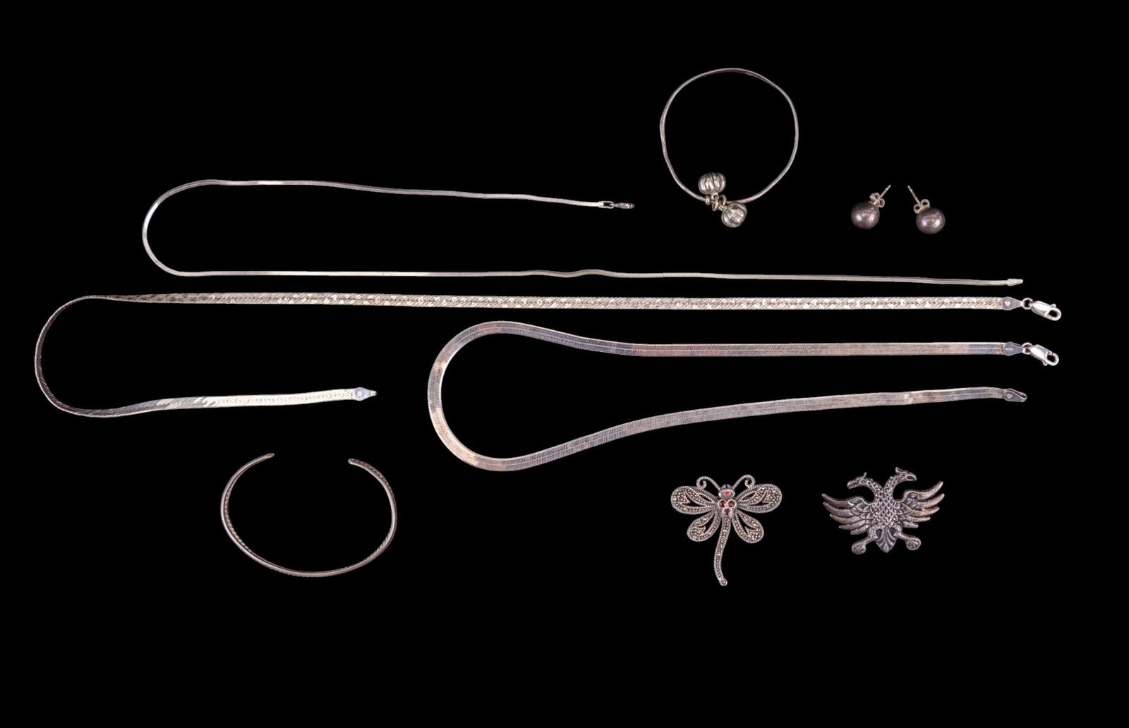 Sterling Silver Chains, Bracelets, Brooches: 20" Italian sterling chain, 18" Italian sterling herringbone chain, a thin 20" Italian sterling chain, sterling double headed eagle brooch, sterling dragonfly brooch with garnet, 2 sterling